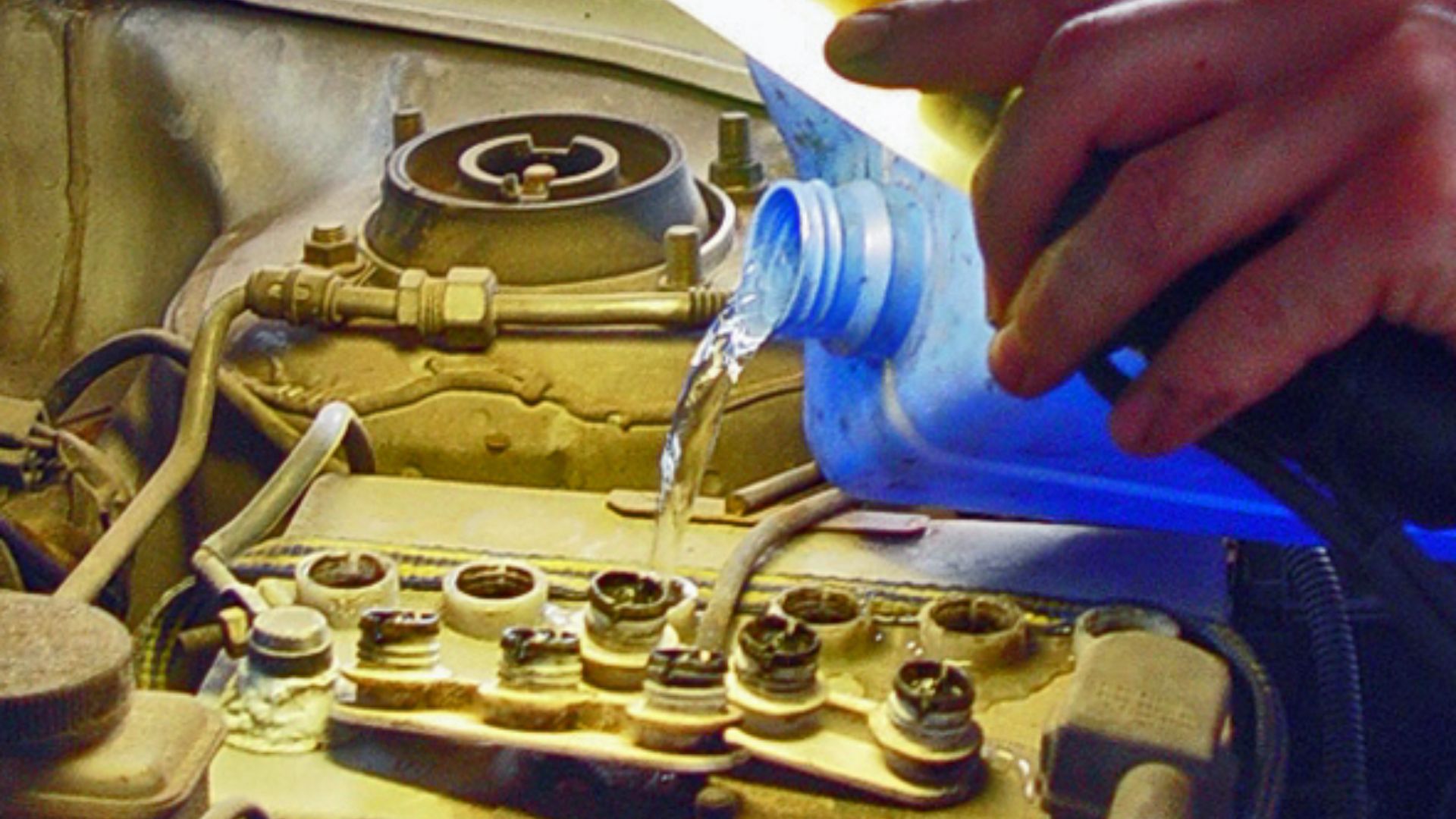 Filling a car battery with distilled water
