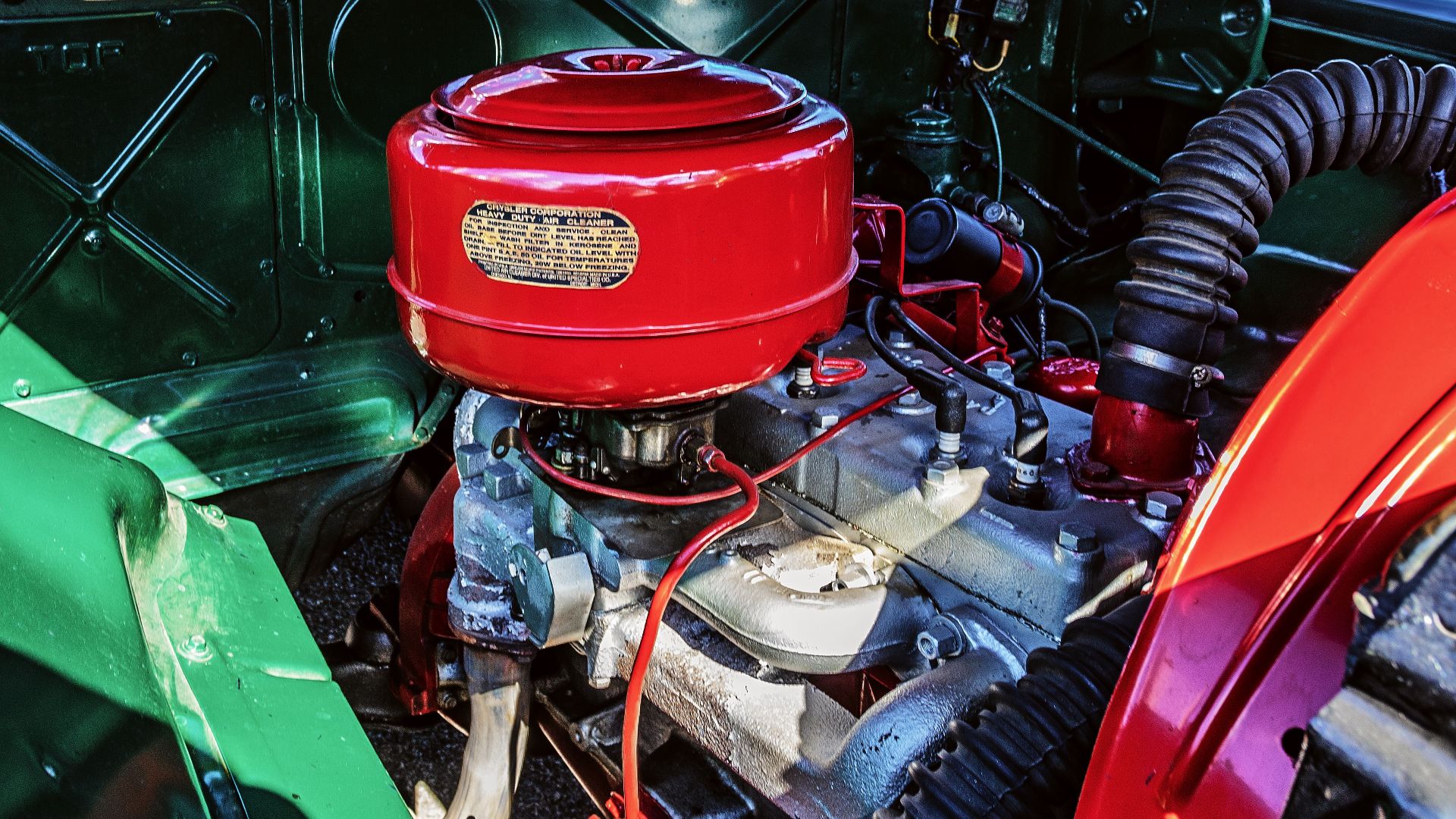 Detailed view of a classic Plymouth car engine, showcasing vintage automotive design.