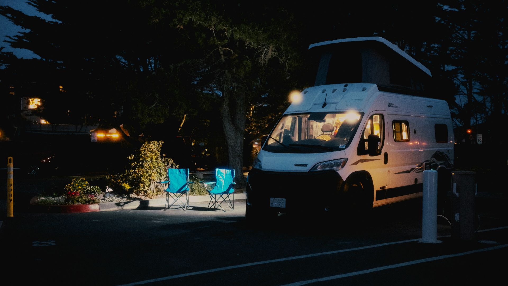 Campervan parked at a campsite at night