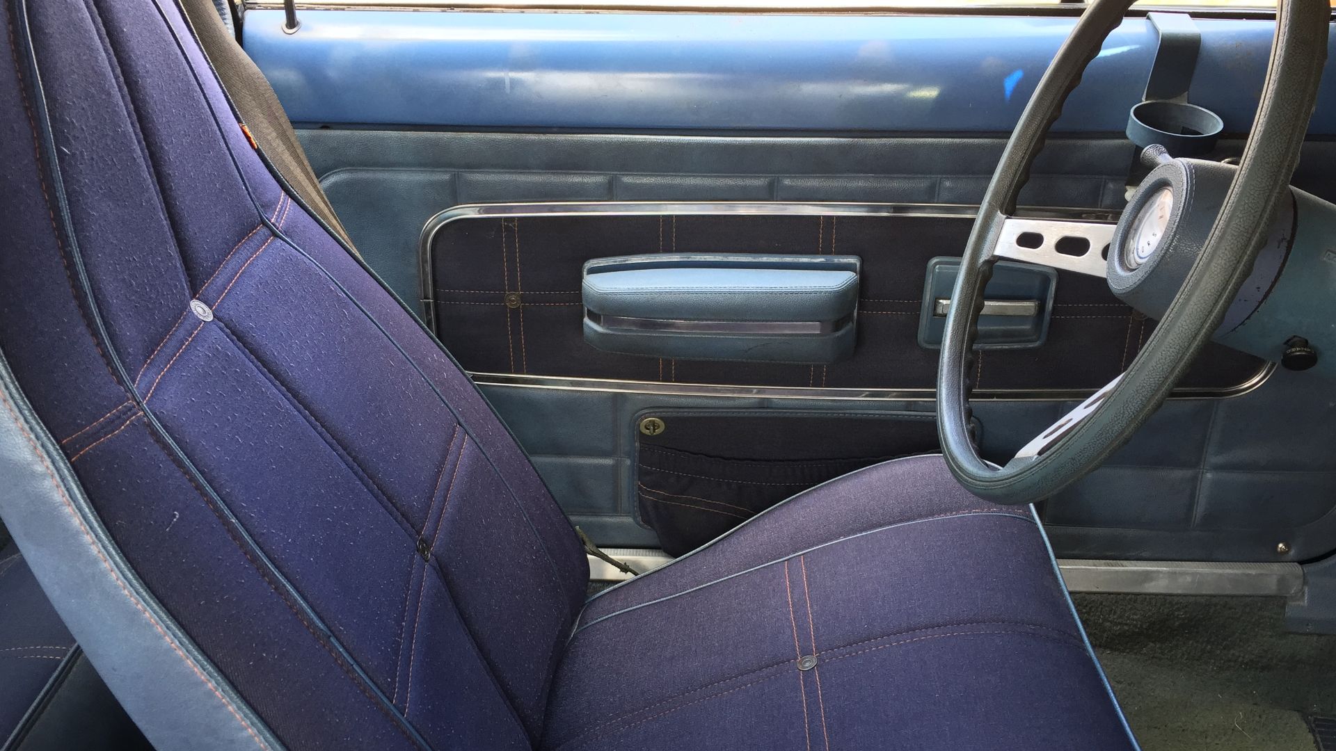1974 AMC Gremlin, a subcompact car built by American Motors Corporation (AMC). This black car features the optional Levi’s interior trim option. Real denim was not used because it was not tough enough to serve as automobile upholstery. AMC turned to spun 