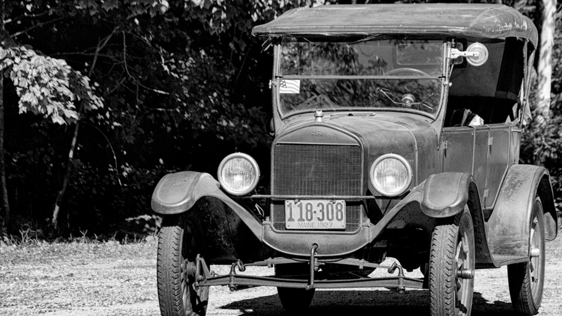 I guess Model T's did not have some of the features we taken for granted.  I don't mean bluetooth and cd players.  In this case a handy small rock makes an effective parking brake.  When I took this I did not see the person in the passenger seat.  A bit g