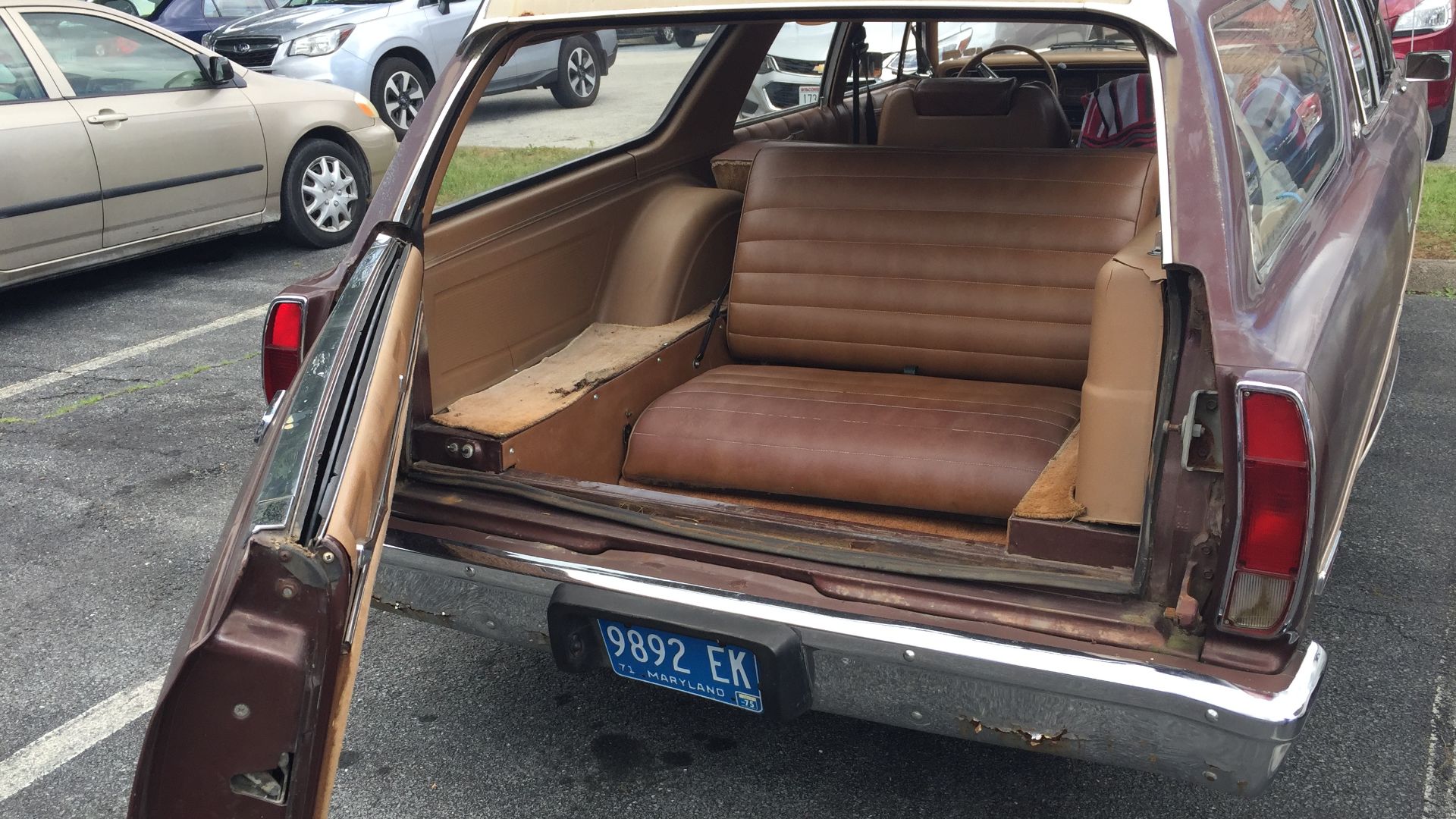 1975 AMC Matador four-door station wagon with room and comfort for eight adult passengers. A large-sized car built by American Motors Corporation (AMC). This car is finished in brown or Cocoa Metallic with a tan interior. It has three rows of seats and th