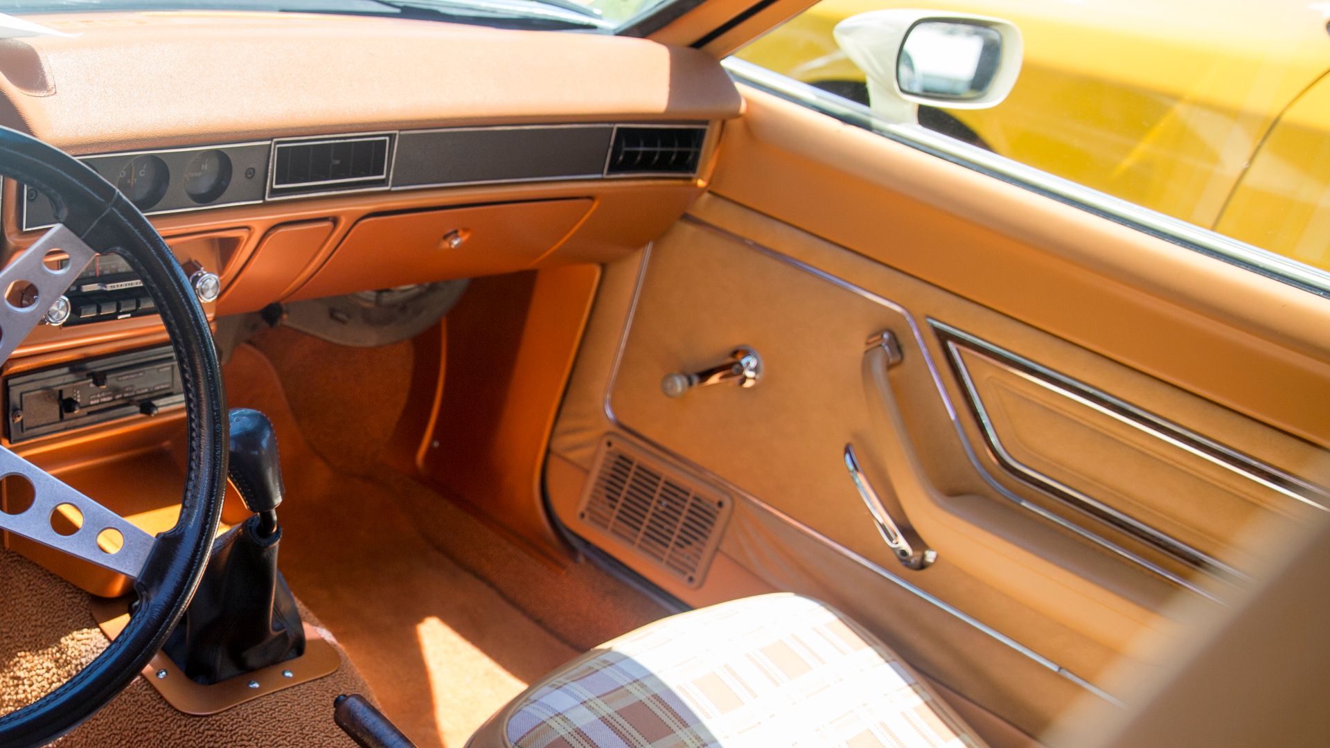 The interior of a Canadian market 1977 Ford Pinto Squire Wagon, displayed as part of the Concours de Lemons event which made up part of the 2022 Greenwich Concours d'Elegance.