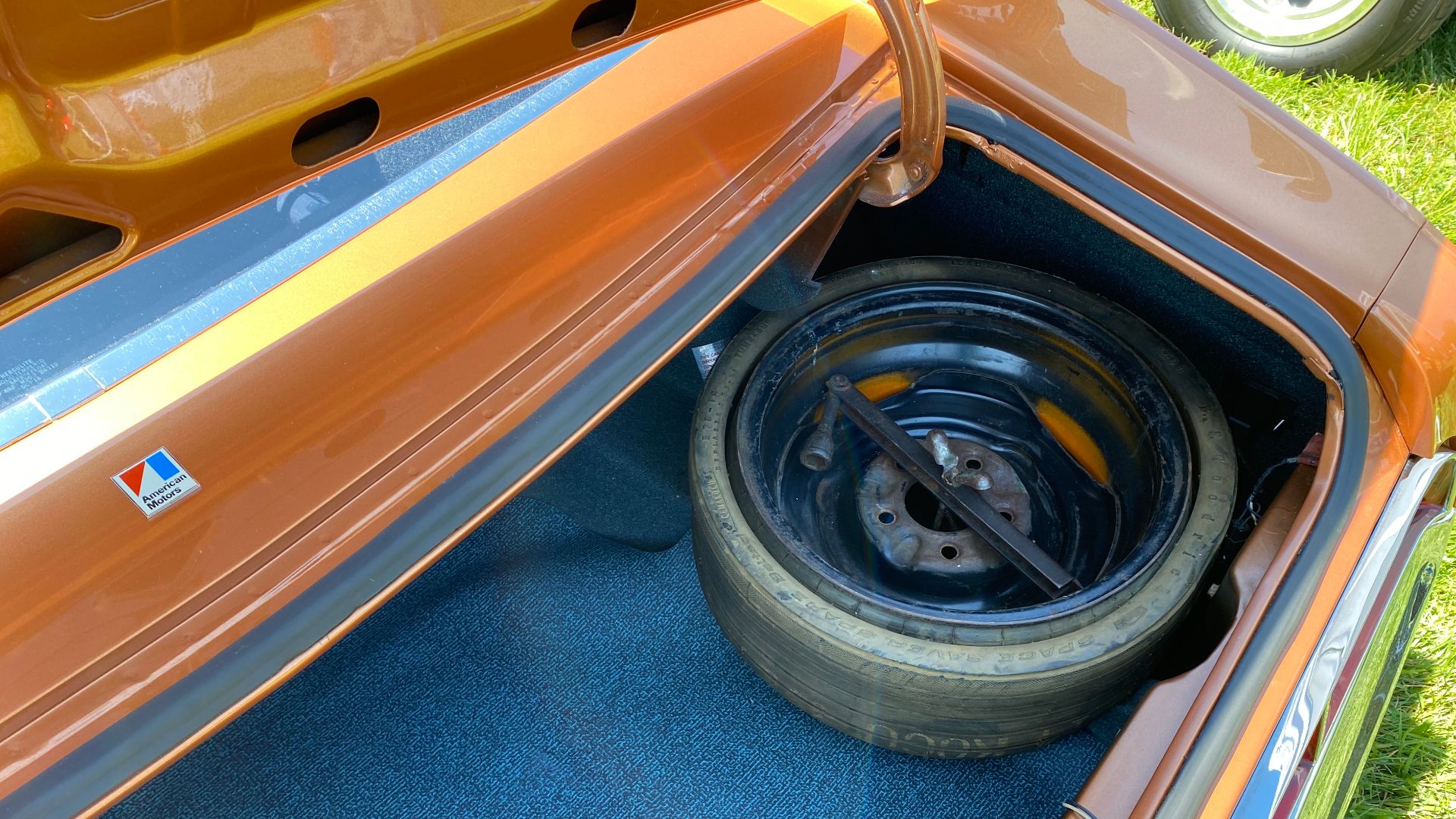 1970 AMX, a sports coupe by American Motors Corporation (AMC). It is a two-seat Grand Touring-type muscle car finished in Bittersweet Orange with black