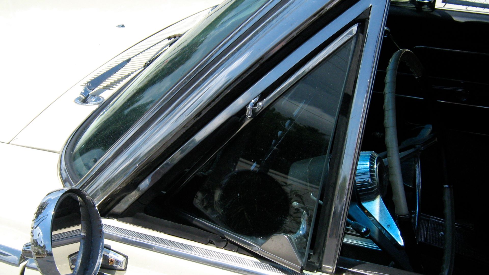 American Motors (AMC) 1965 Rambler 990 Ambassador convertible. Detail of driver's side vent window and the factory (remote adjustable) outside rear view mirror.