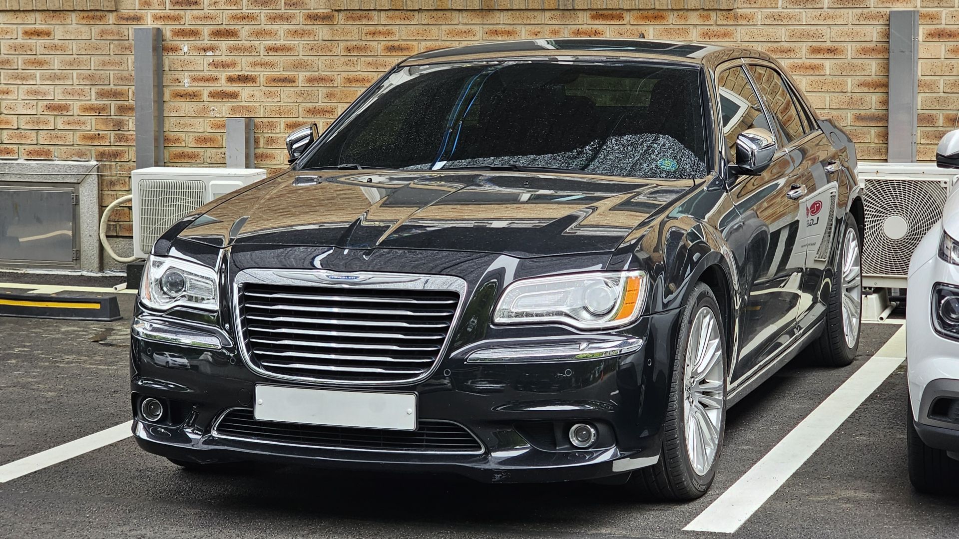 Gloss Black Chrysler 300 C 3.6 LD sedan.