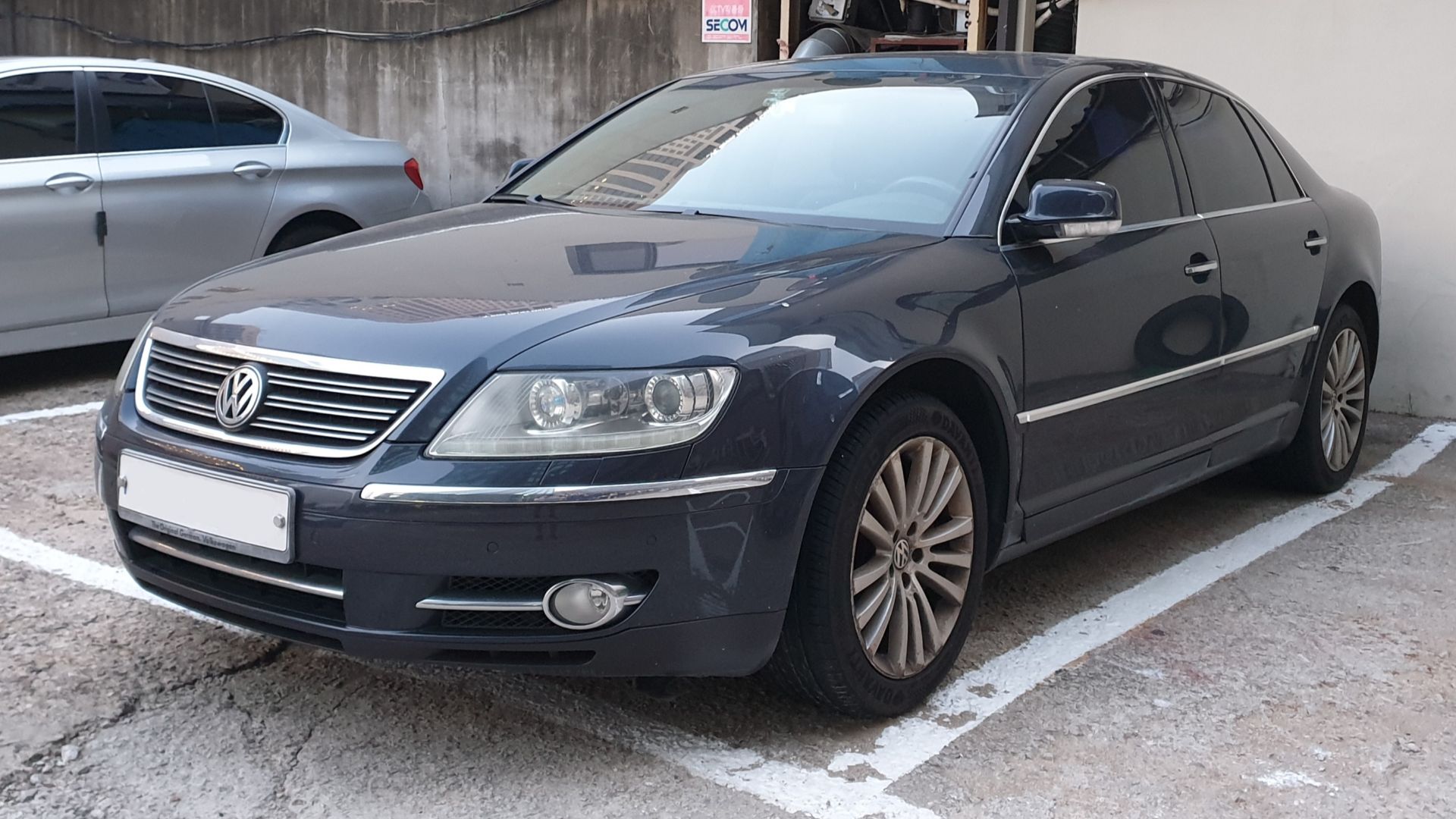 Blue Volkswagen Phaeton sedan.