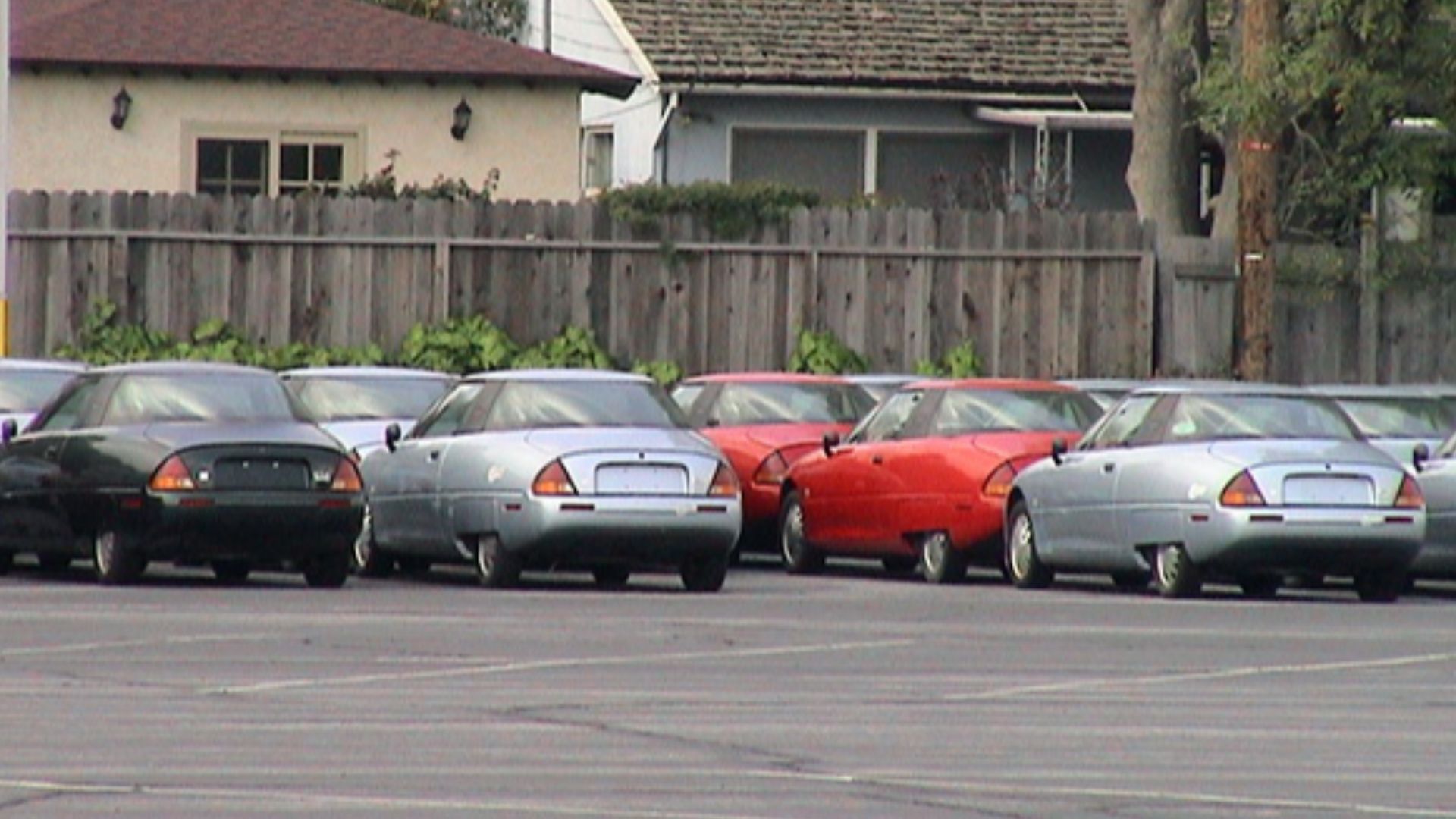 Reclaimed GM EV1s parked at GM's training center in Burbank, California, awaiting transfer for final crushing (this version was trimmed a bit to improved layout)