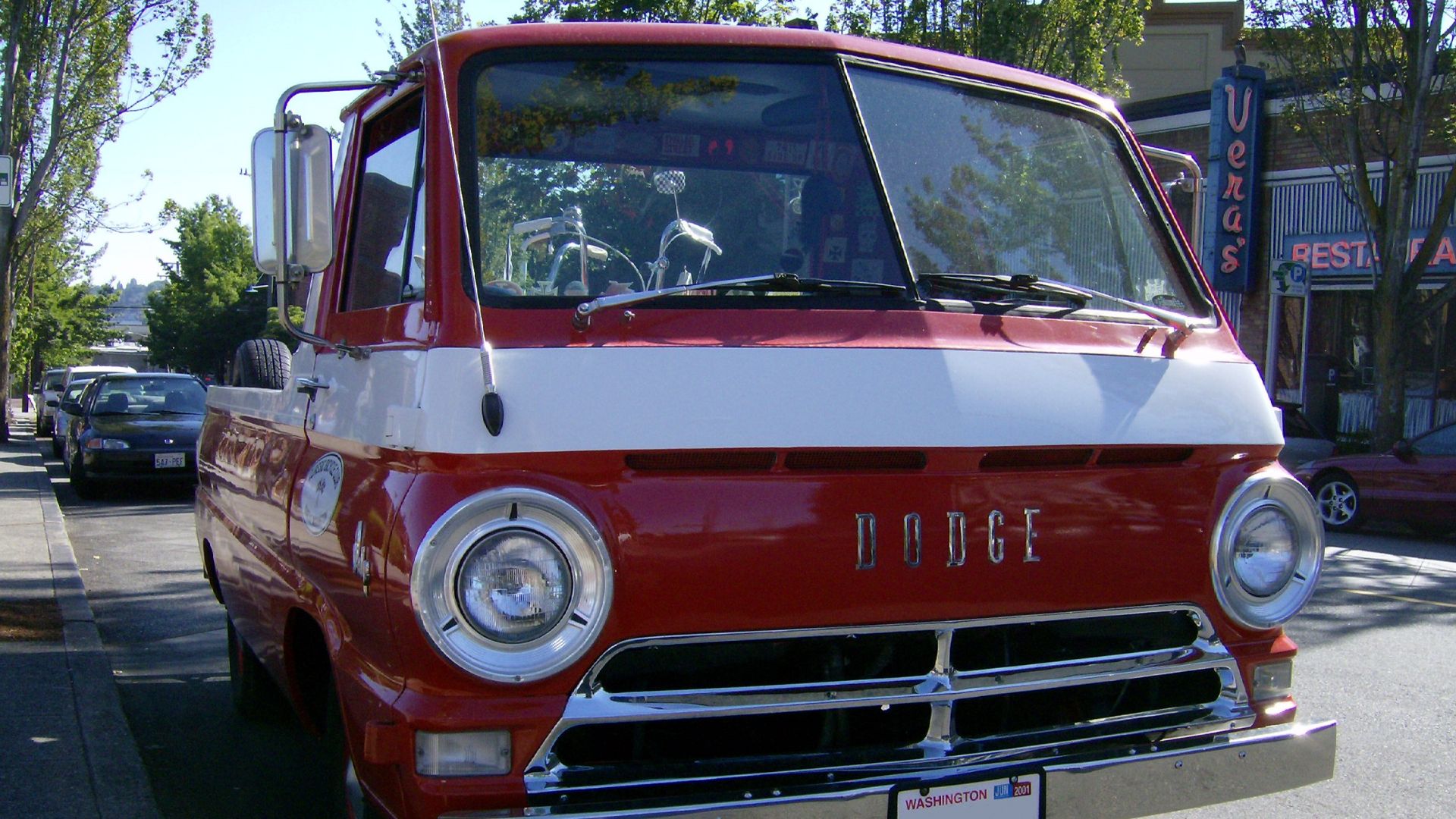 A Dodge A100 pickup truck of an unknown model year, likely mid-sixties. I airbrushed out the license plate number, (while doing so I noticed the tags were expired by at least six years at the time of the photograph. Weird.) This photograph was taken at th