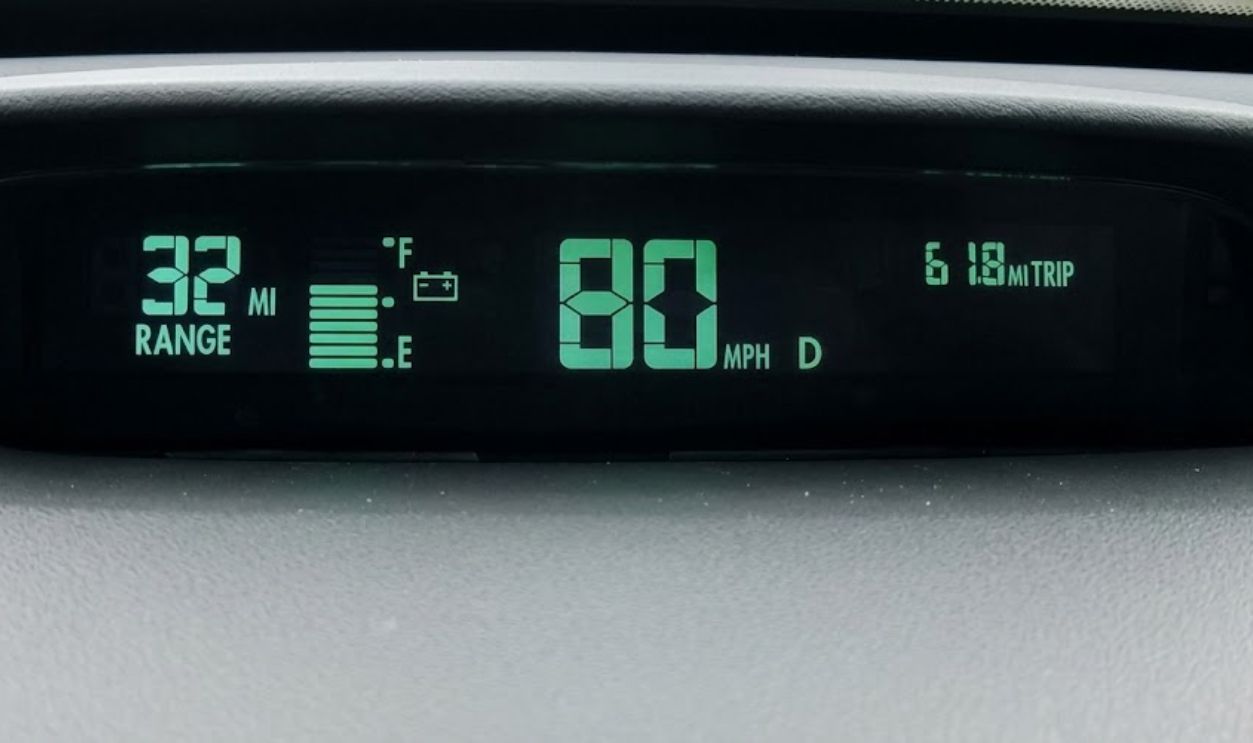 GM EV1 central dash digital panel showing range left, battery charge, speed and trip length