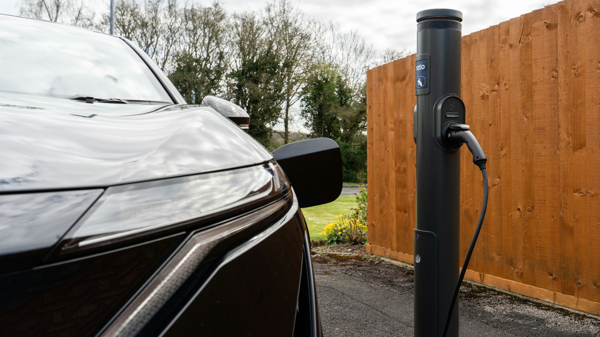 Modern electric car plugged into a charging station