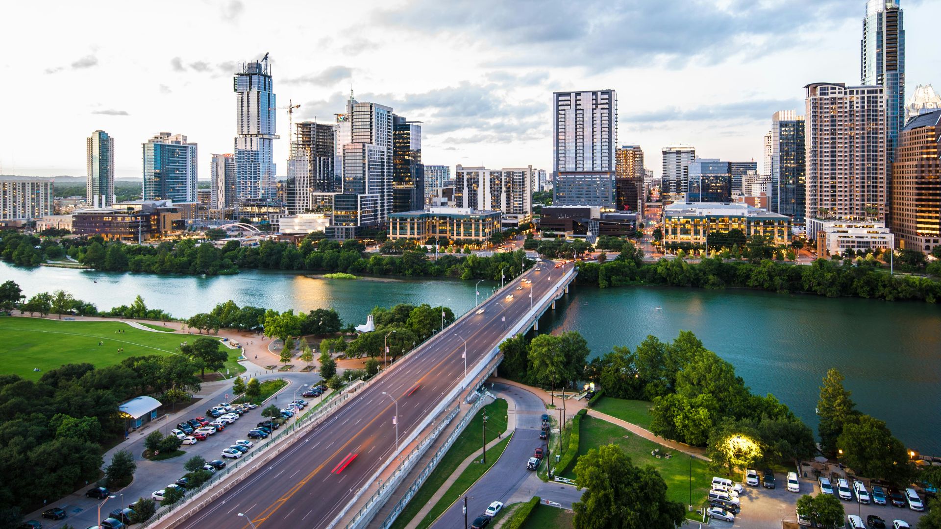 An aerial view of the Austin skyline and Congress Avenue Bridge over Lady Bird Lake