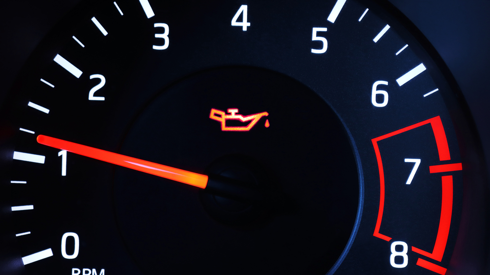 Oil pressure warning light illuminated on dashboard.