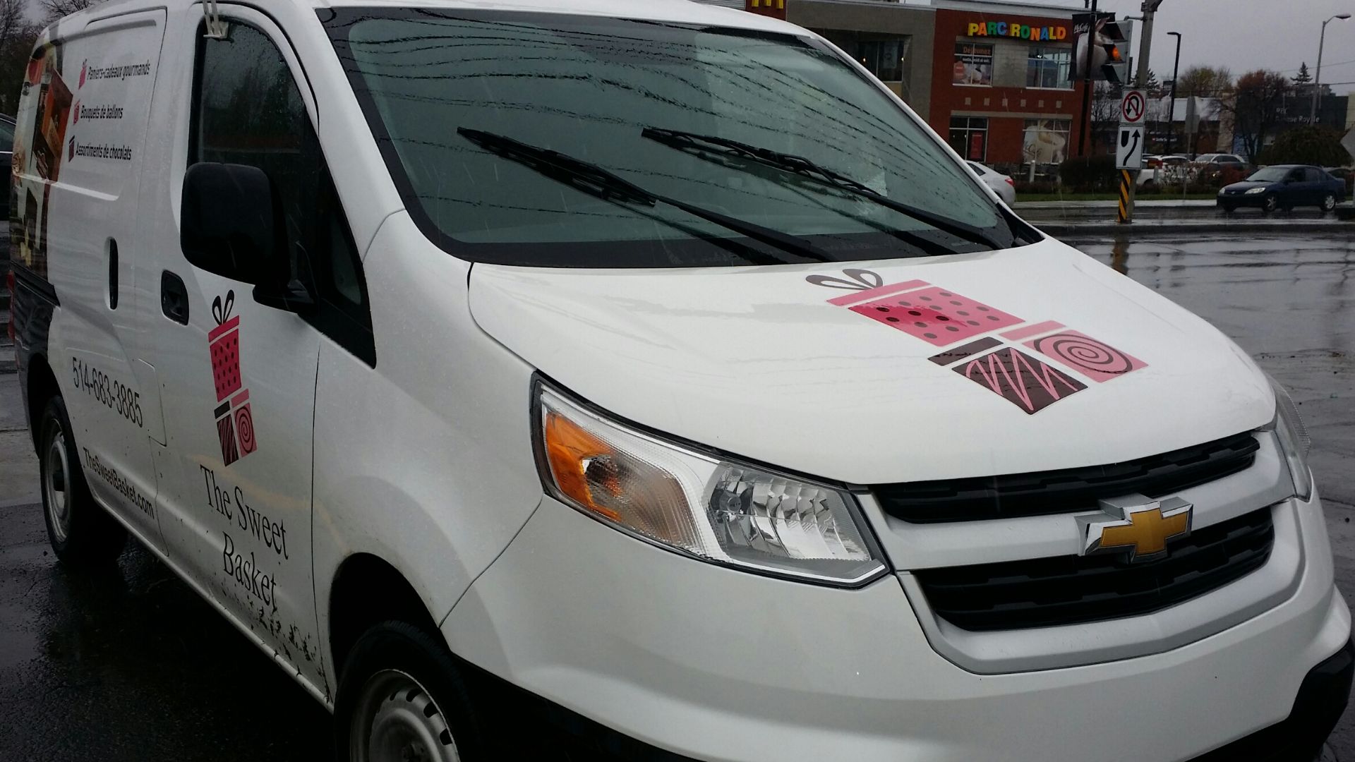 2015-2017 Chevrolet City Express The Sweet Basket photographed in Dollard-Des-Ormeaux, Québec, Canada with a Honda Civic.