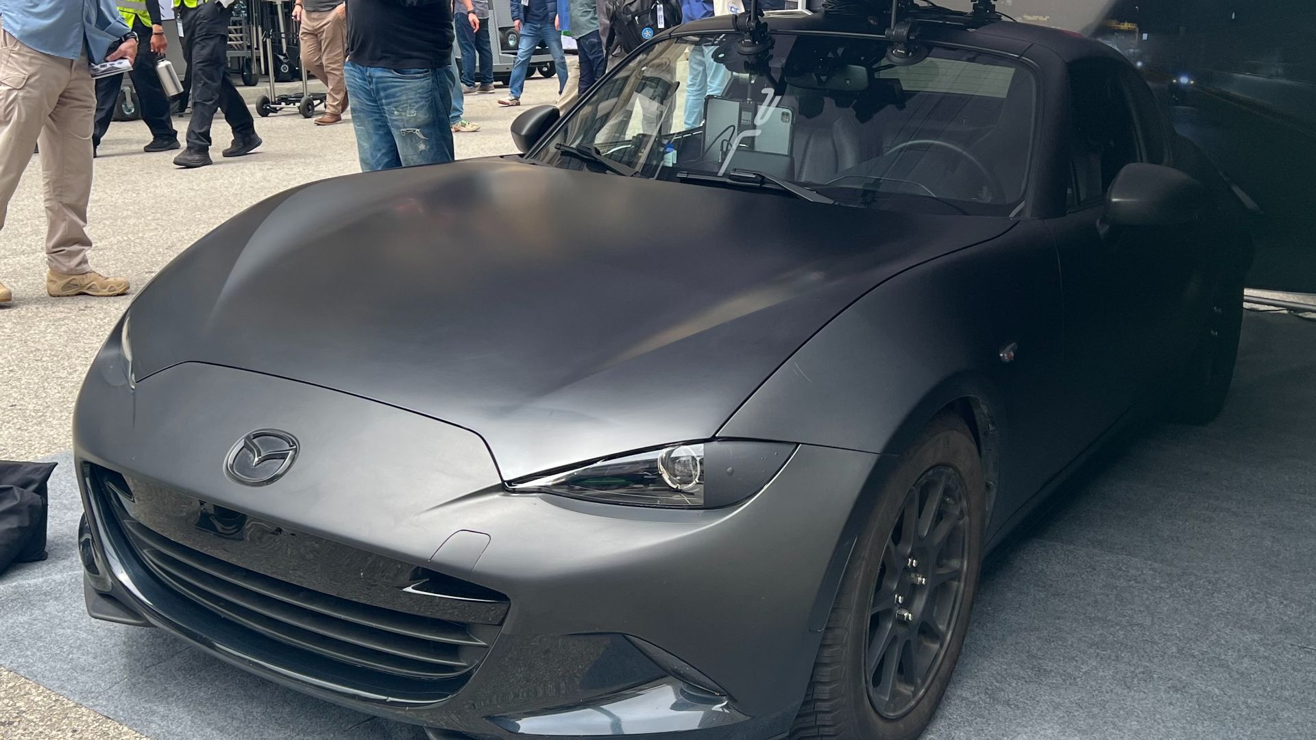 A Mazda MX-5 Miata RF with a set of cameras on its roof used for 360-degree driving footage.