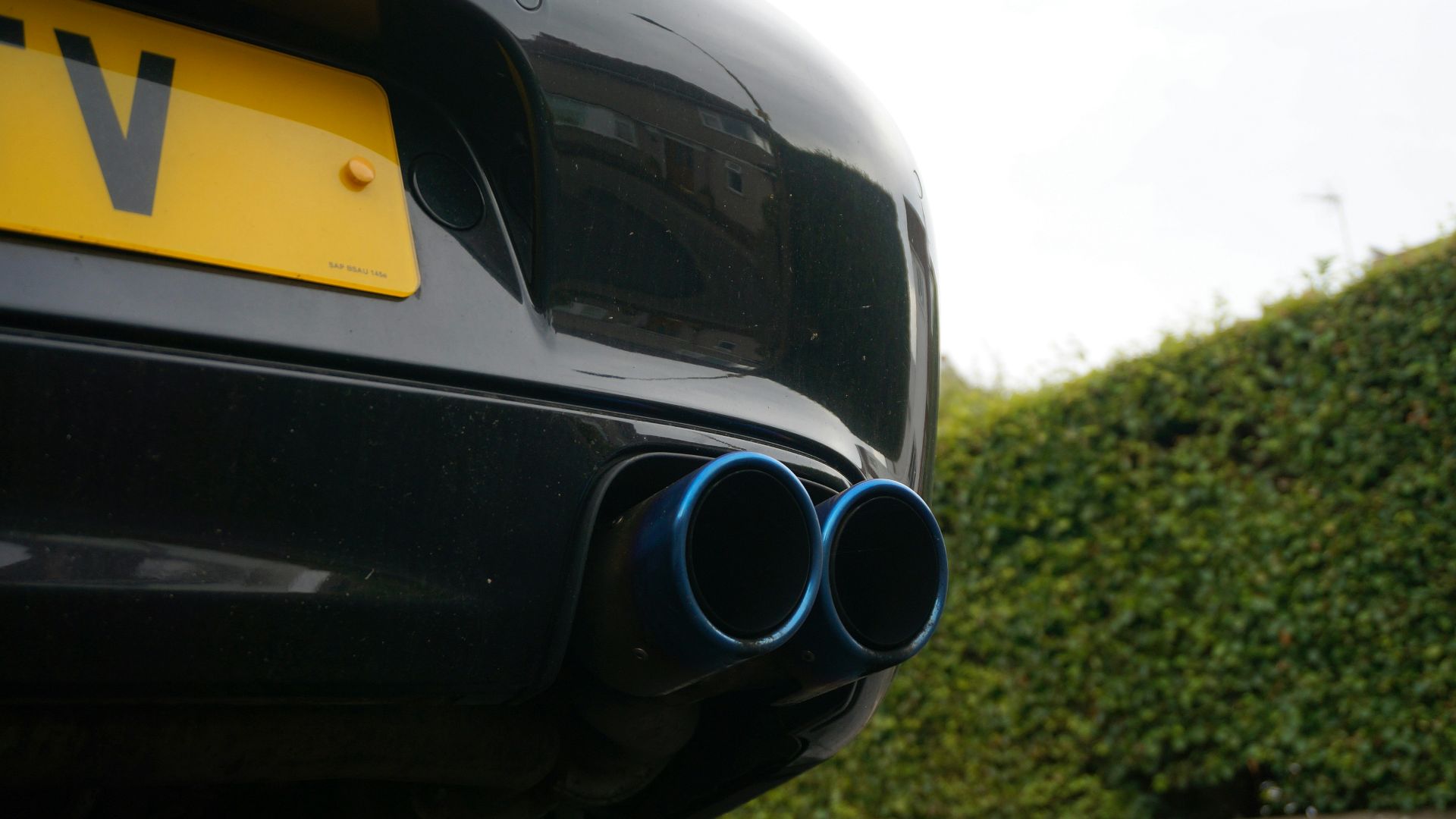 Close-up of blue exhaust pipes on a car