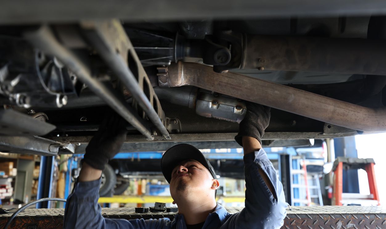 Mechanic Working under Car 1408112344