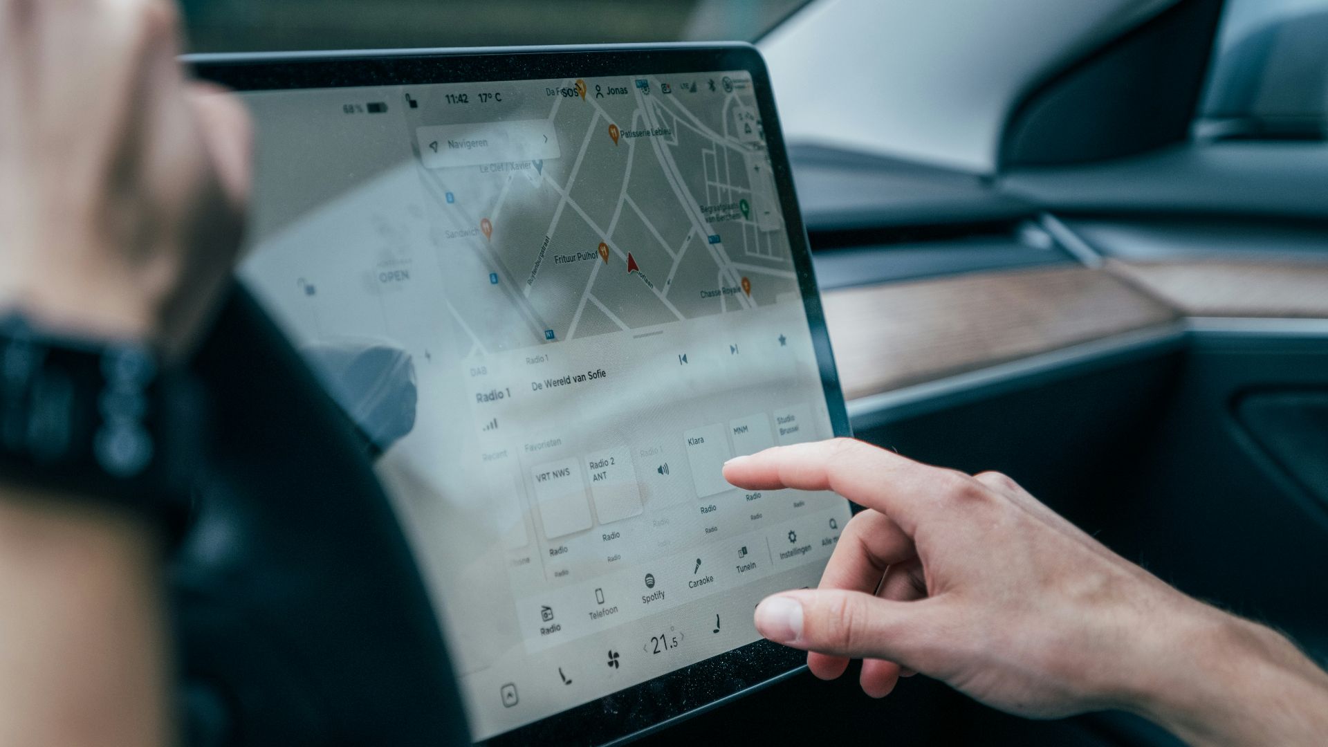a person using a laptop in a car