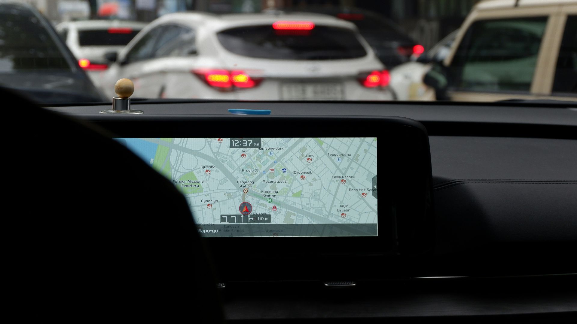 A car with a gps device on the dashboard