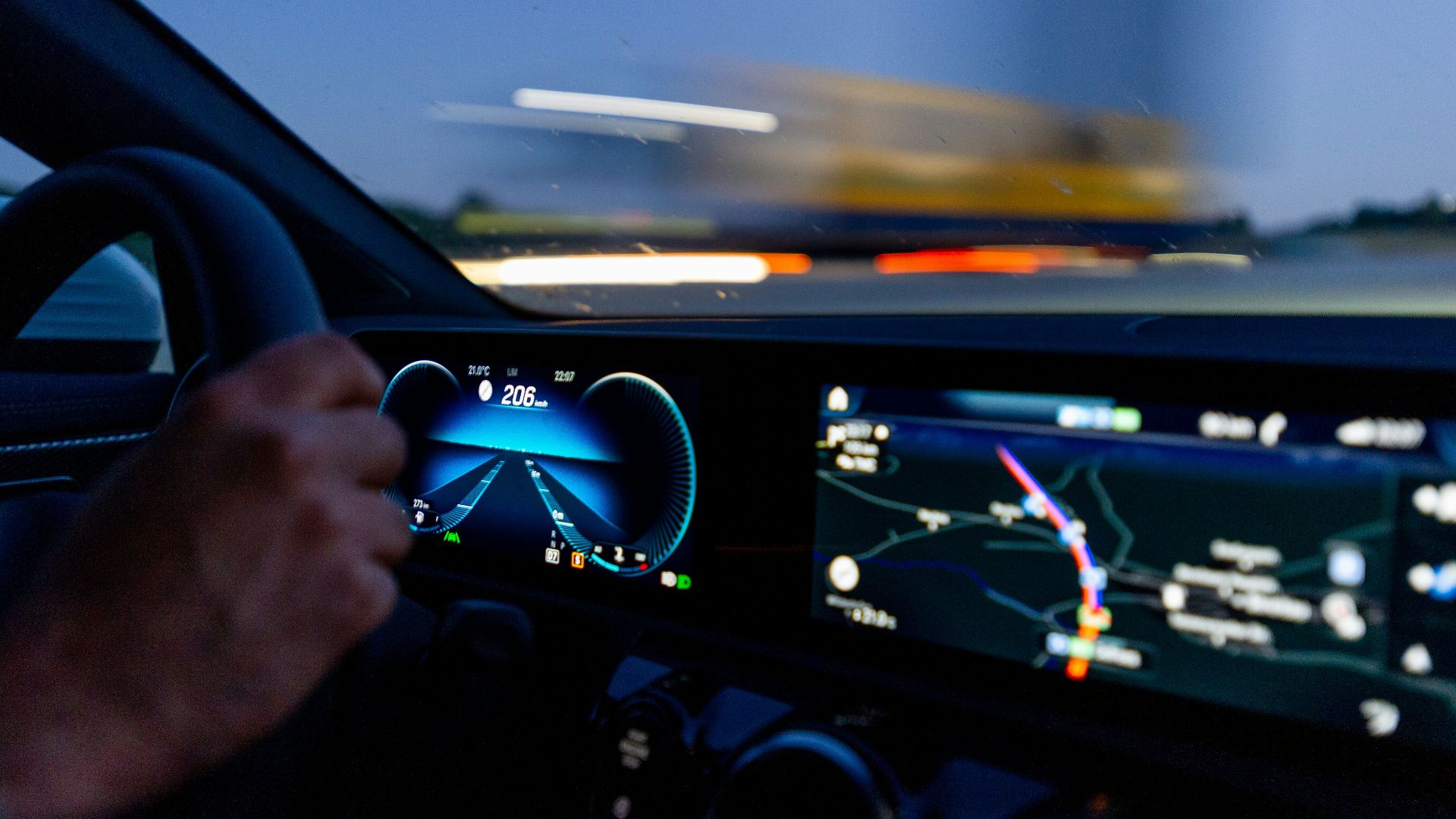 person's hand on steering wheel