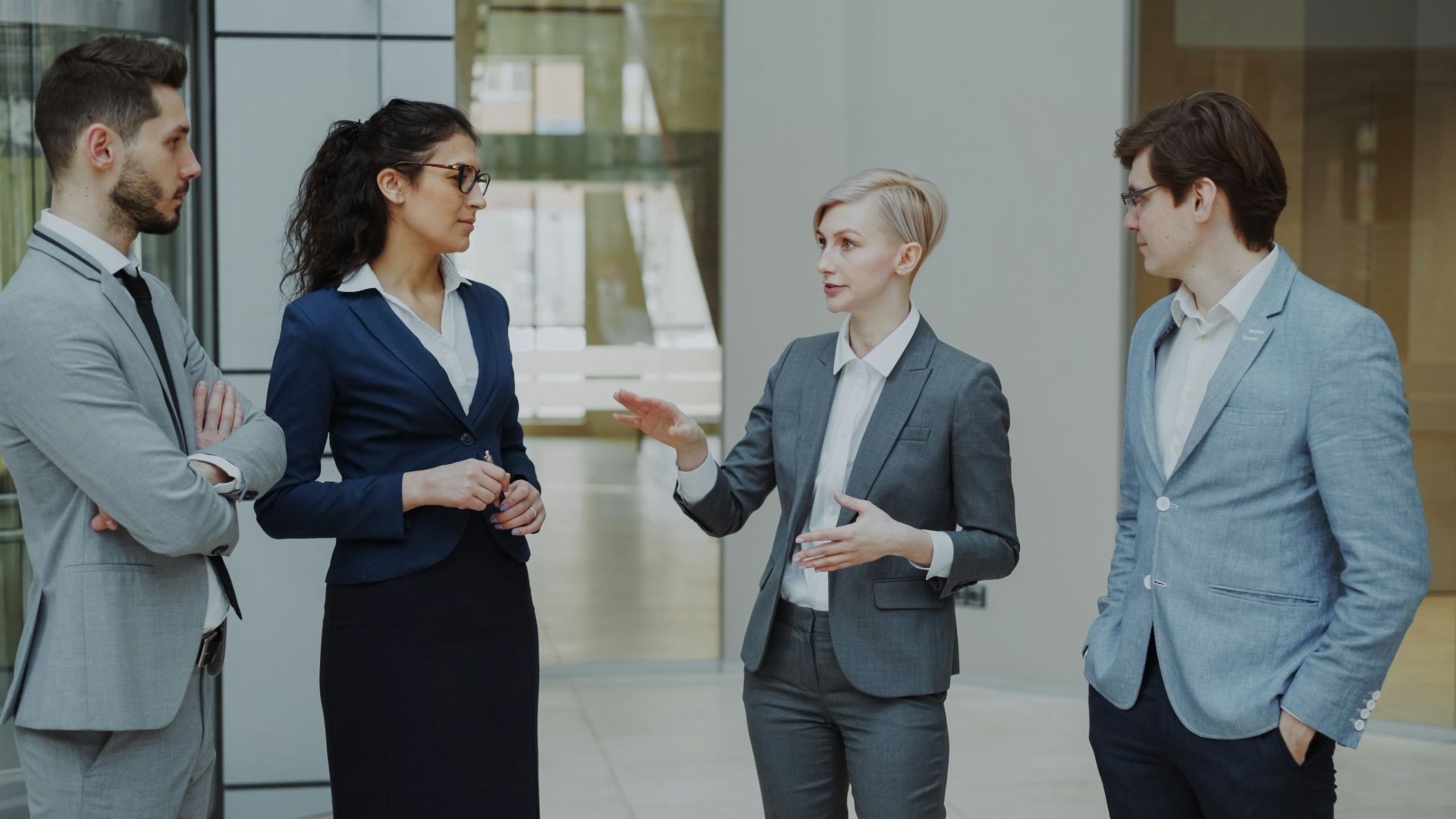 Four business professionals in a meeting discussing ideas