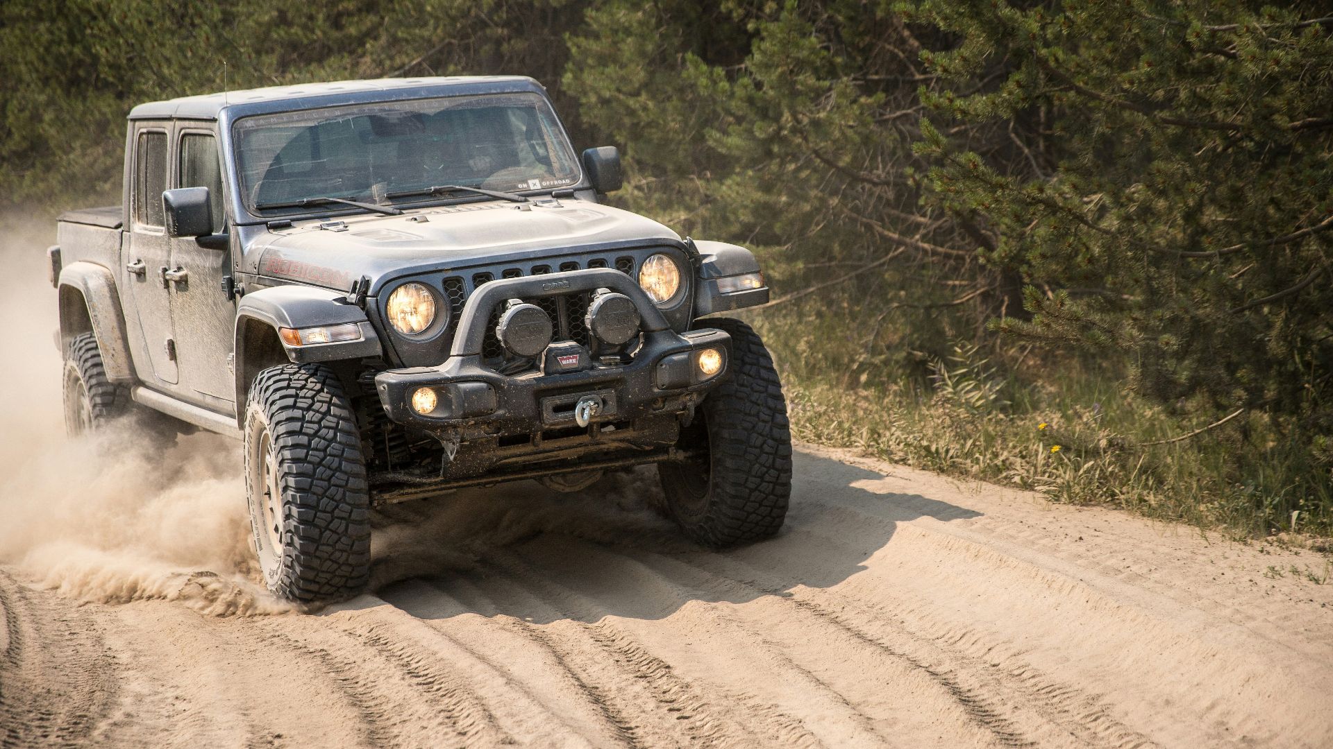 black and white jeep wrangler on dirt road during daytime
