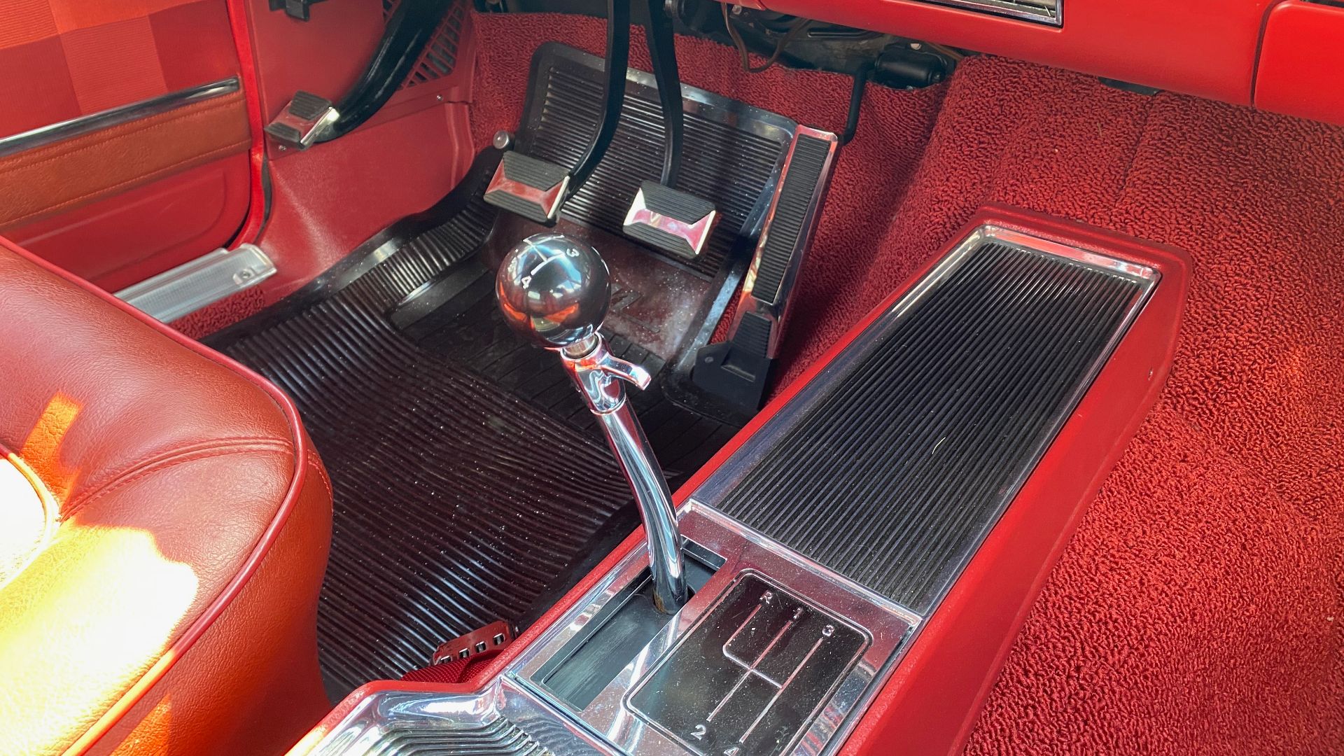 1966 Rambler Classic 770 convertible built by American Motors Corporation (AMC) - finished in black with black power convertible top and red interior with bucket seats upholstered in Hialeah Plaid fabric with matching trim on the door panels, a center arm
