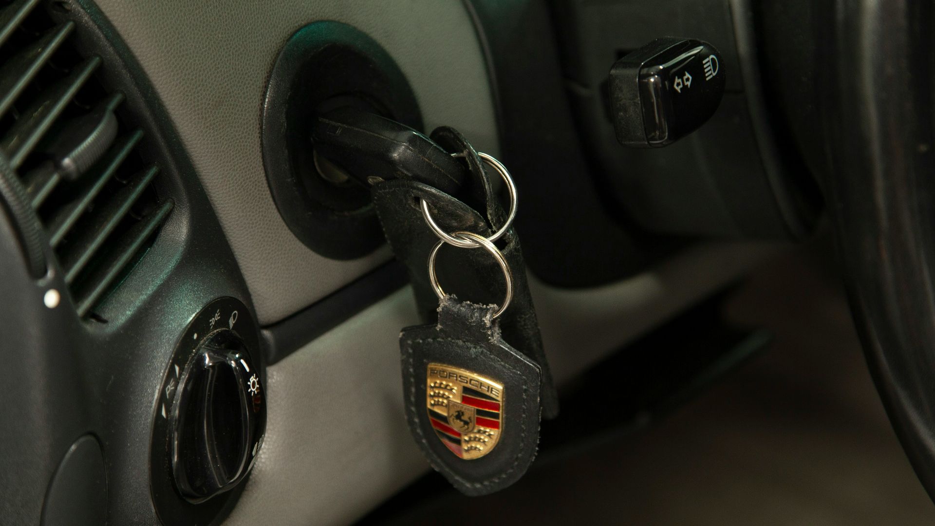 A car door handle with a car key on it