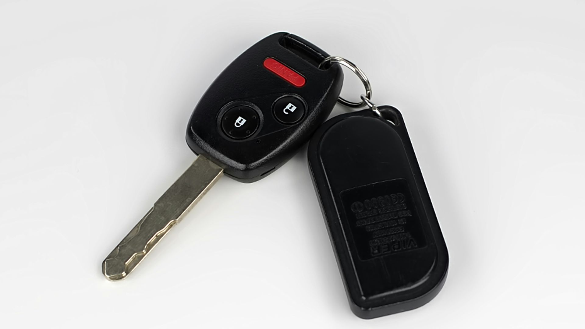 a car key with a remote control attached to it