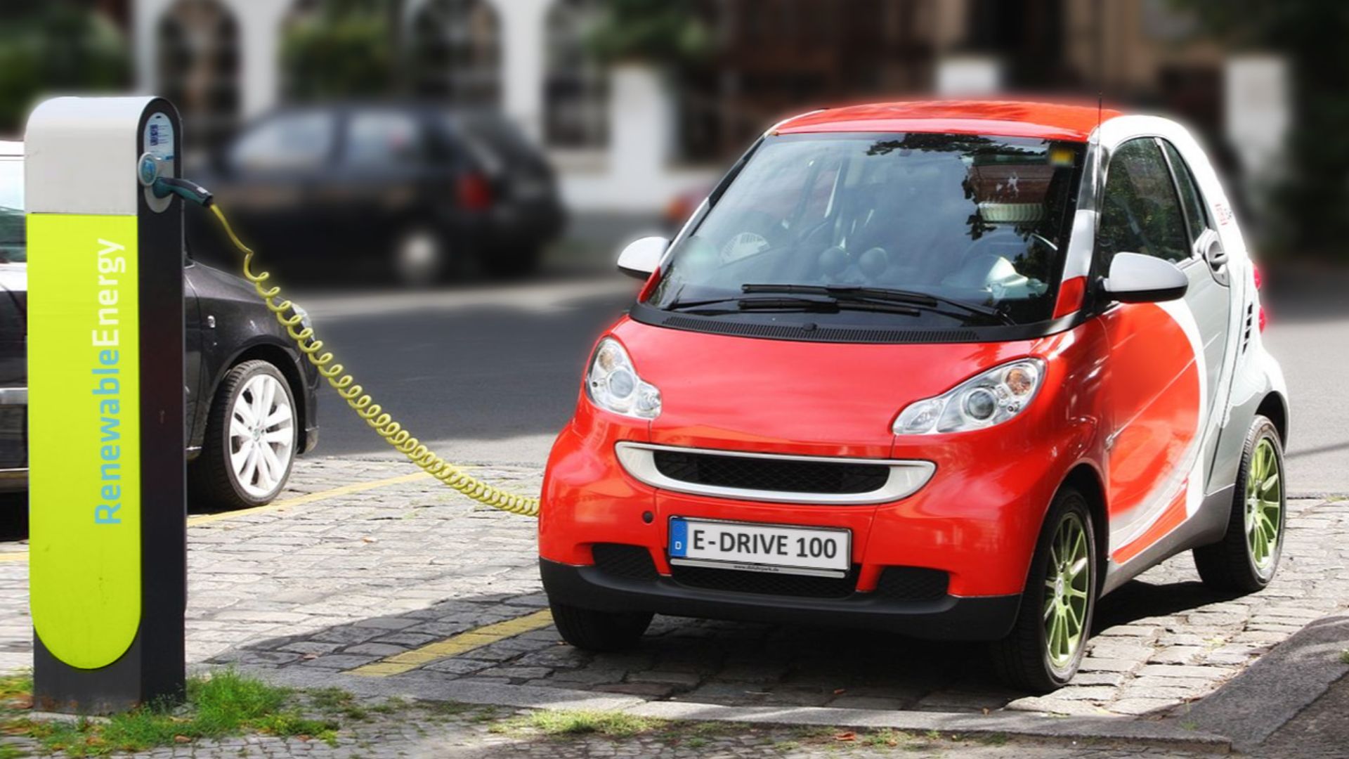 electric car recharging in Berlin, Germany – dummy/fake registration plate and charging station logo