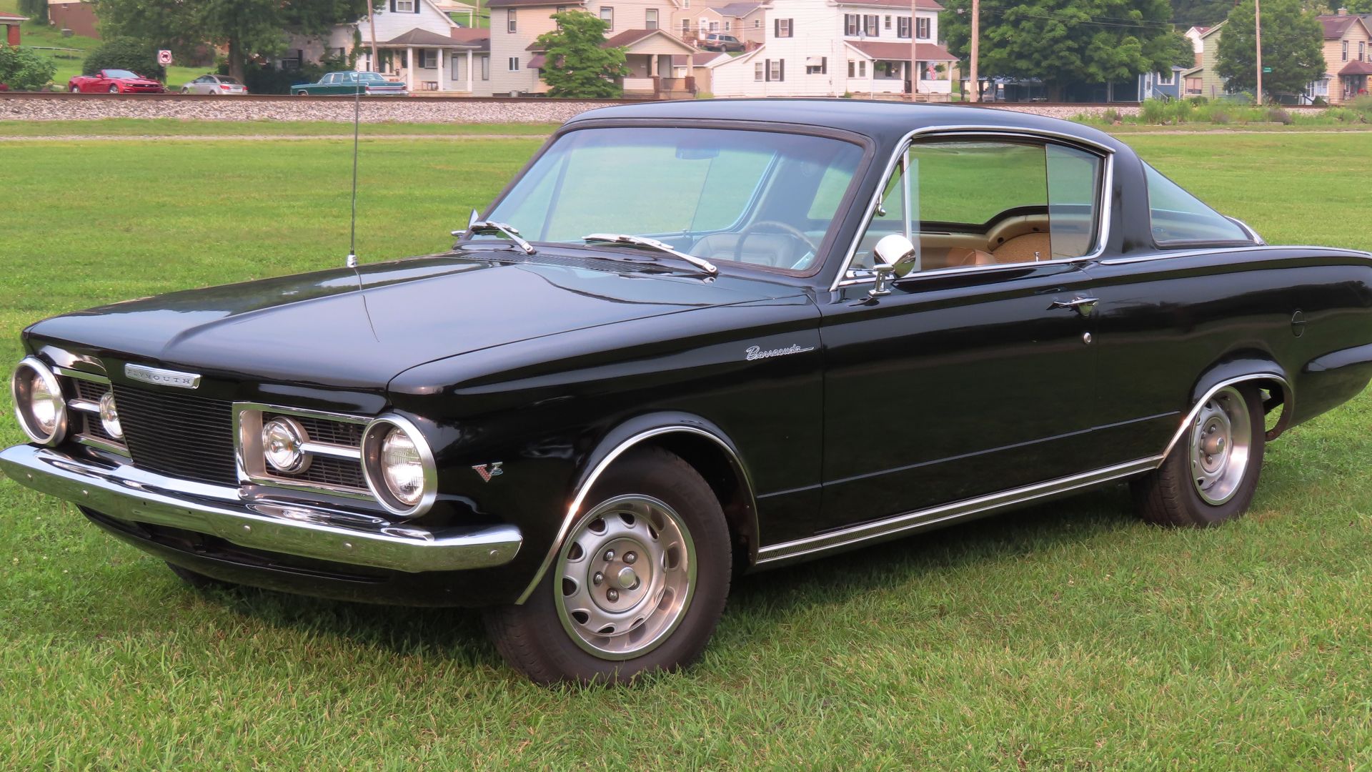 1964 Plymouth Barracuda photographed at the July 17, 2023 Cruisin' the River Lowellville Car Show in Lowellville, Ohio. Finished in Black.