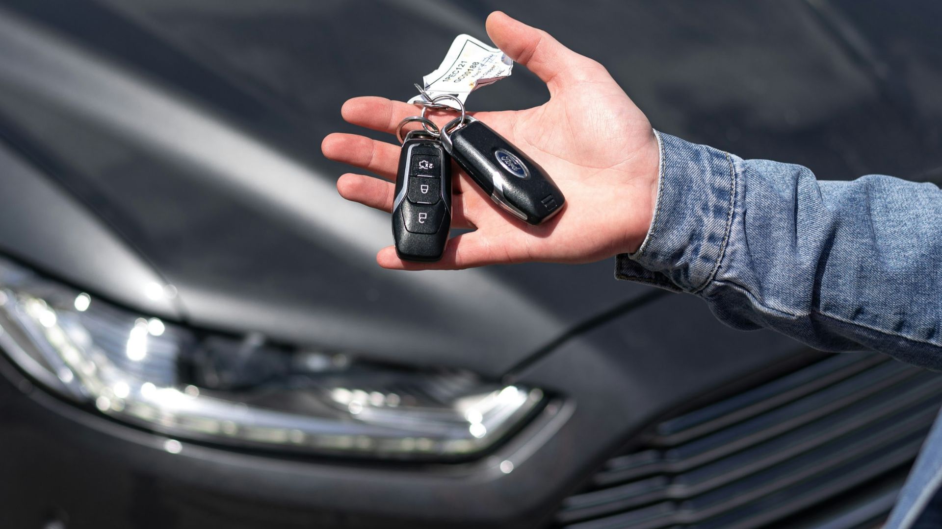 a hand holding a key