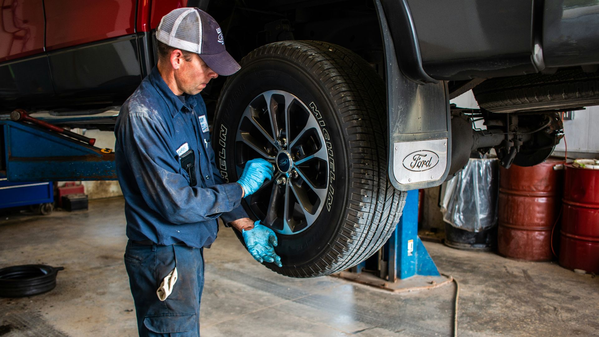 man holding lug wrench