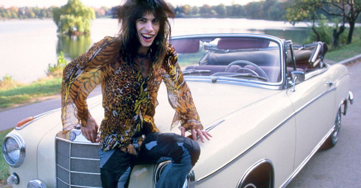 Steven Tyler of rock group Aerosmith in his 1956 Mercedes Benz 220S at Jamaica Pond, Boston MA October 9, 1975