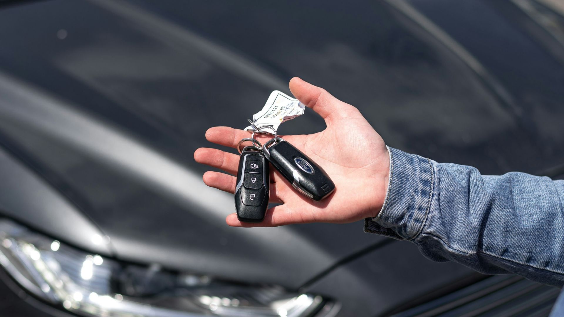 a hand holding a key
