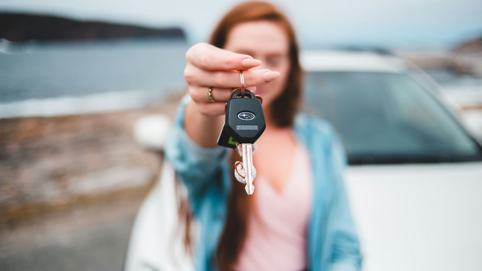 focus photography of black vehicle key