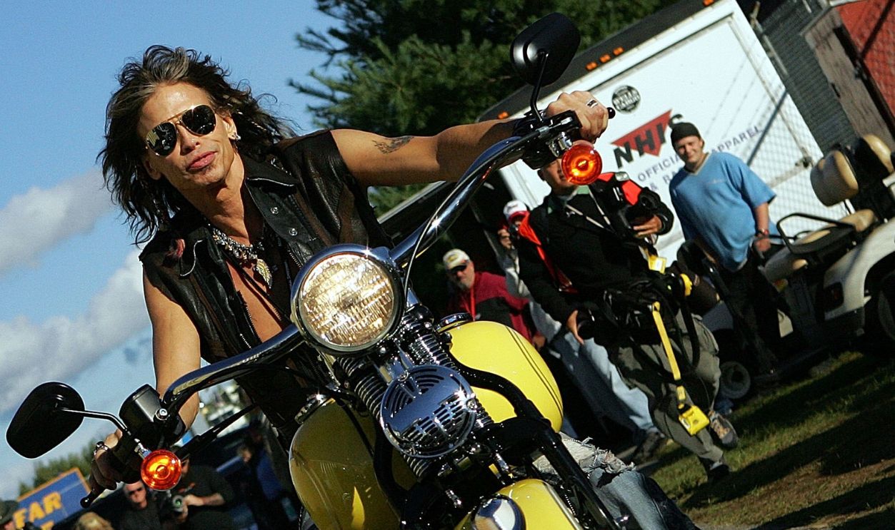 LOUDON, NH - SEPTEMBER 15: Singer Steven Tyler rides up to the media center at New Hampshire International Speedway on September 15, 2007 in Loudon, New Hampshire.