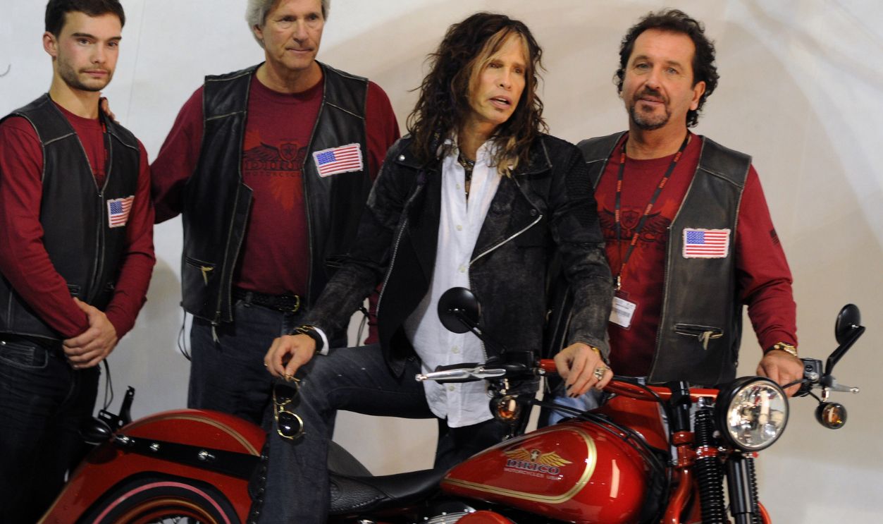 MILAN, ITALY - NOVEMBER 05: Second on the left Mark Dirico, Steven Tyler and Steven Talarico, Steven Tyler's cousin, attend Dirico motor presentation during the EICMA 2013 71st International Motorcycle Exhibition on November 5, 2013 in Milan, Italy.
