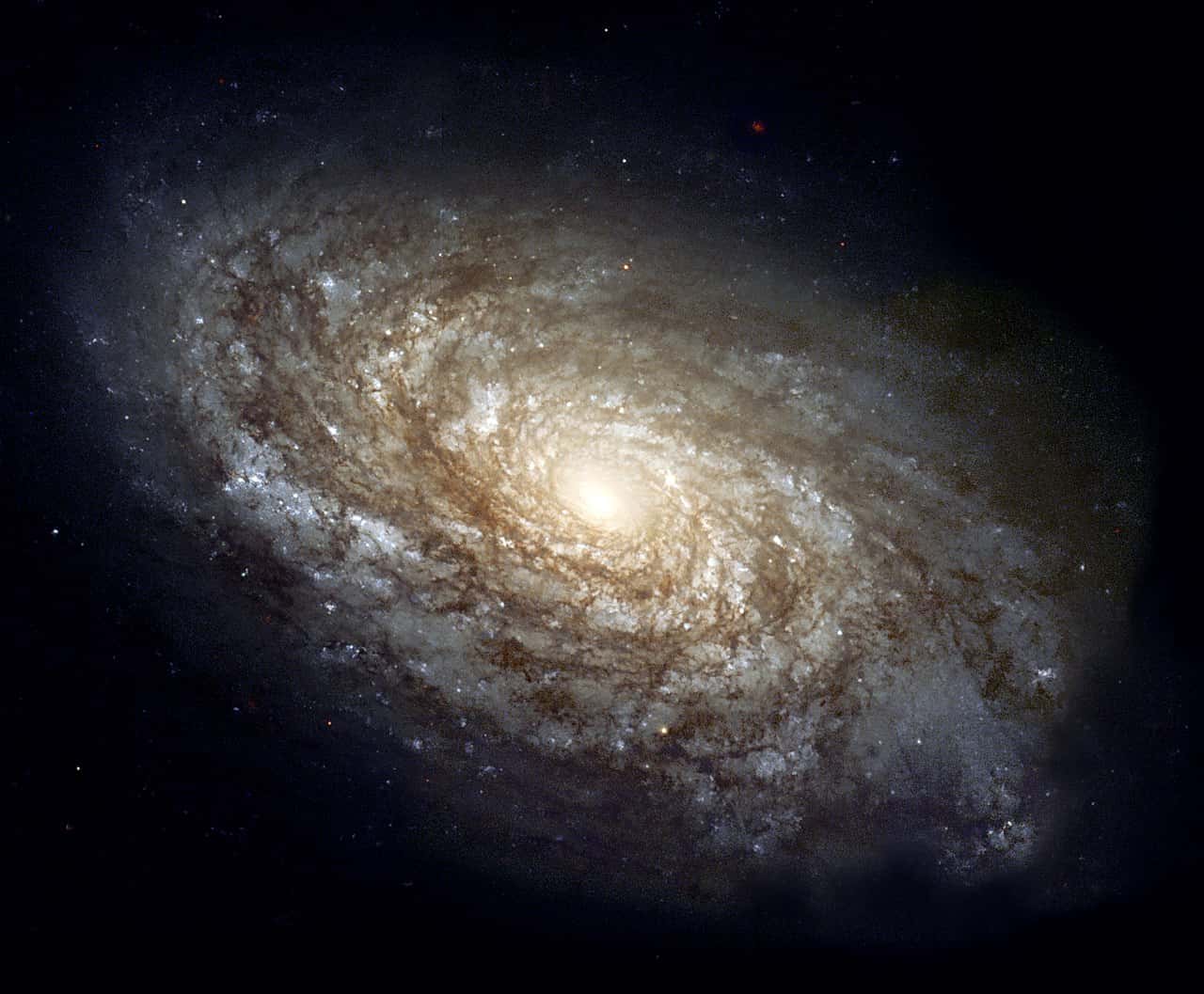 Photo ofthe majestic spiral galaxy NGC 4414 was imaged by the Hubble Space Telescope as part of the HST Key Project