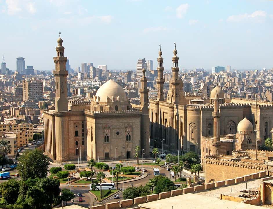 Big mosque in Cairo Egypt surrounded wit other buildings