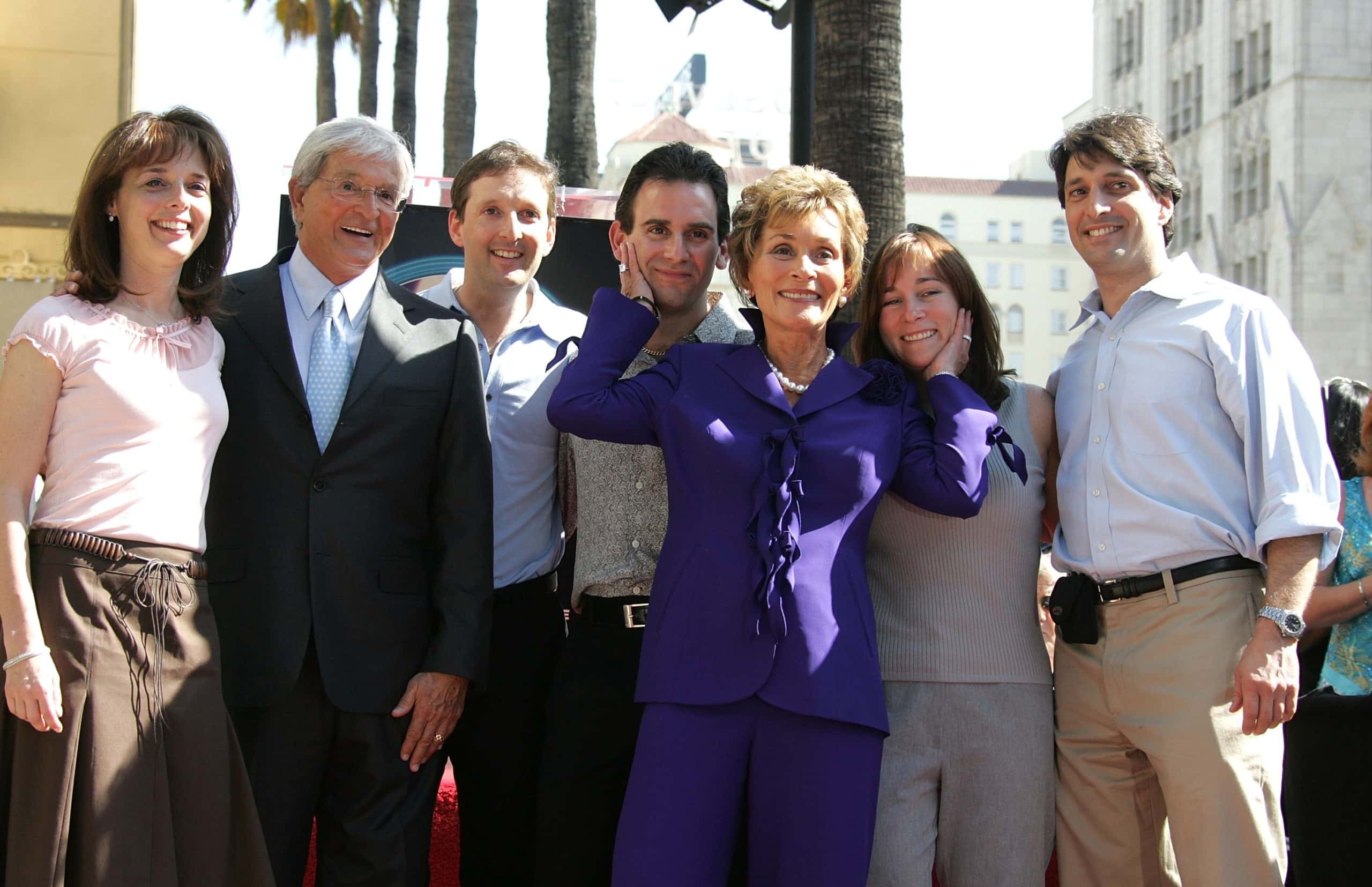 Television reality courtroom star Judge Judy Sheindlin poses with her family as she receives the 2304 star on the Hollywood Walk of Fame