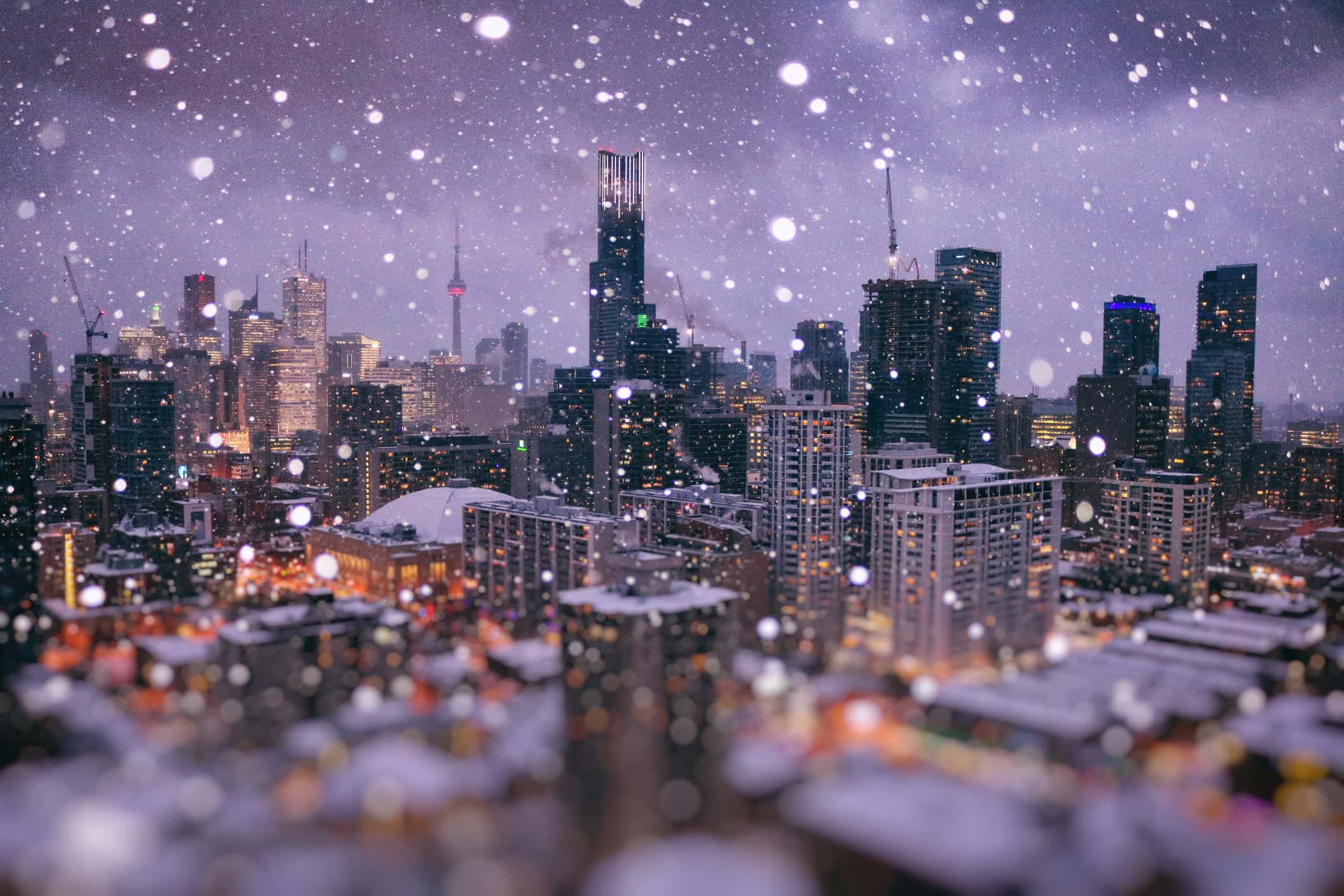 Areal view of sparkling downtown of Toronto during magic blue hour on a snowy day in December.