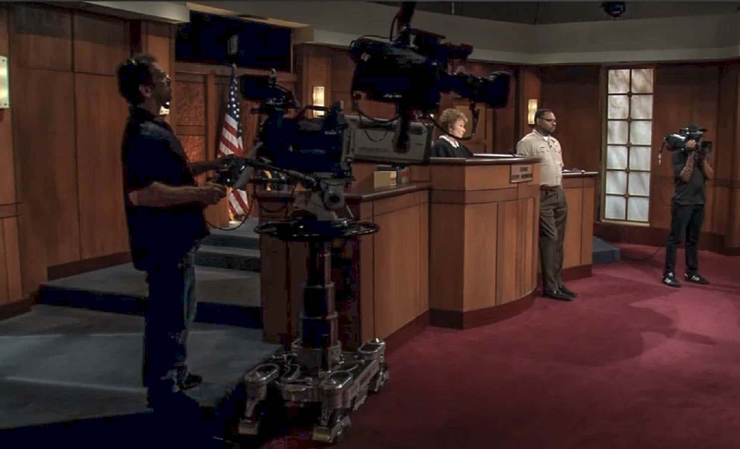 Screenshot from the reality court show Judge Judy (1996-2021), portraing Judy Sheindlin and the filming crew