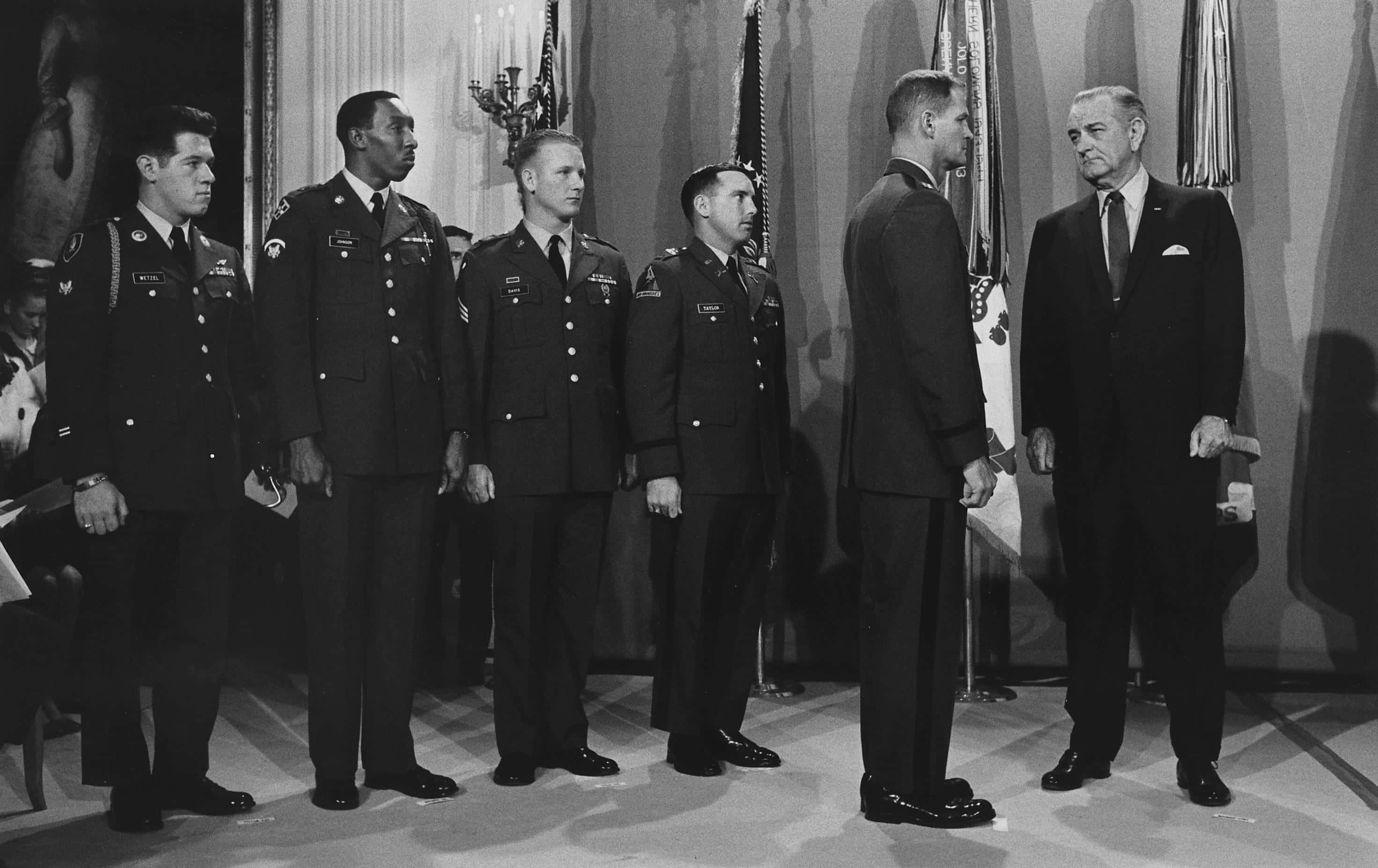 President Lyndon B. Johnson presents Medal of Honor to army men 