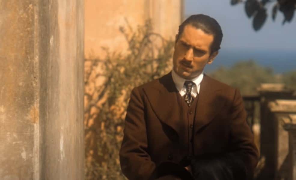 Screenshot of Robert De Niro in brown suit - from The Godfather Part II (1974)