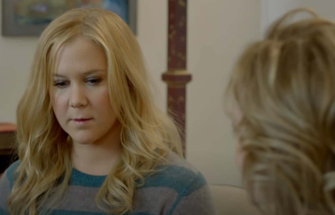Amy Schumer in green sweater on her show
