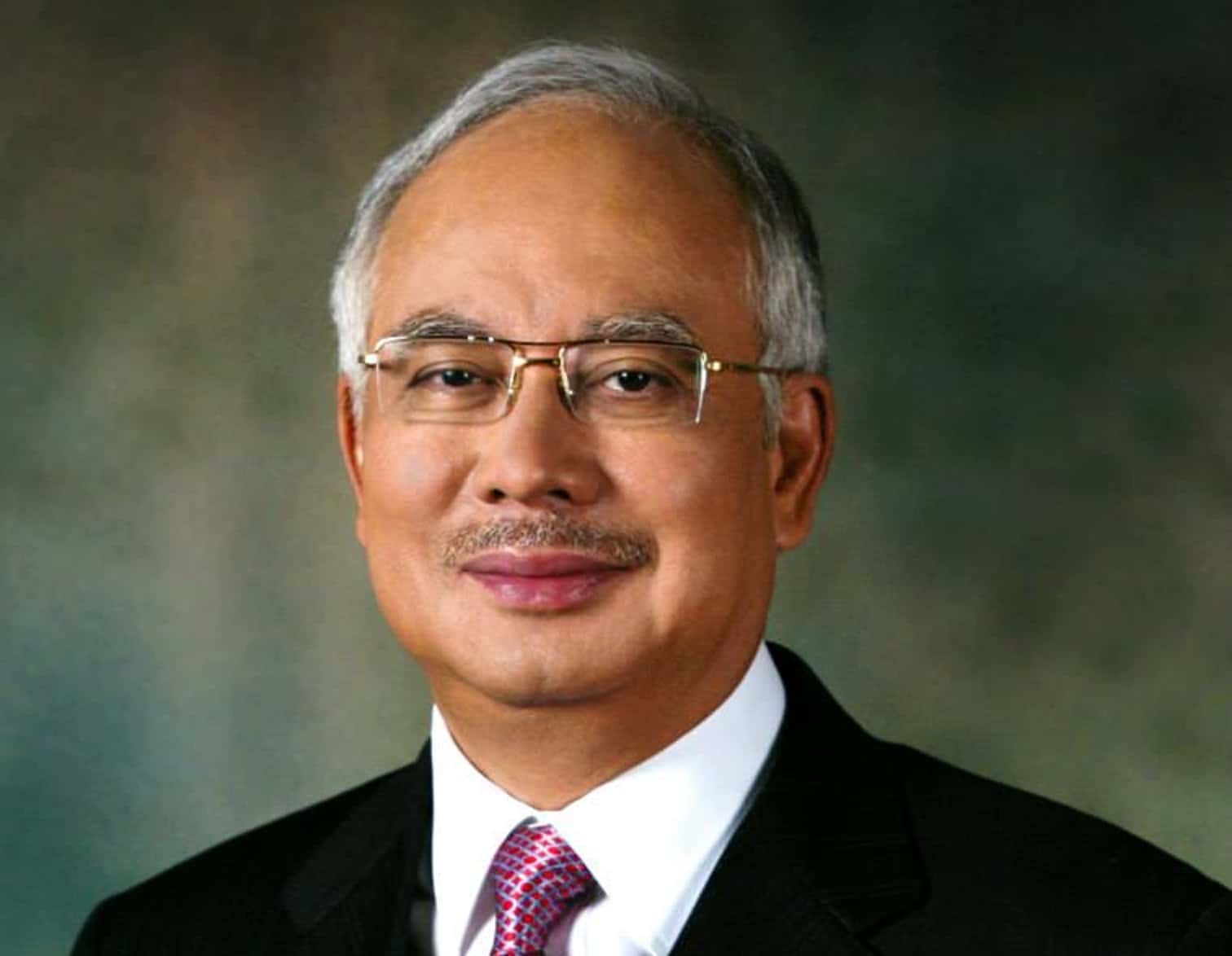 Portrait Photo of Najib Tun Razak in a dark suit