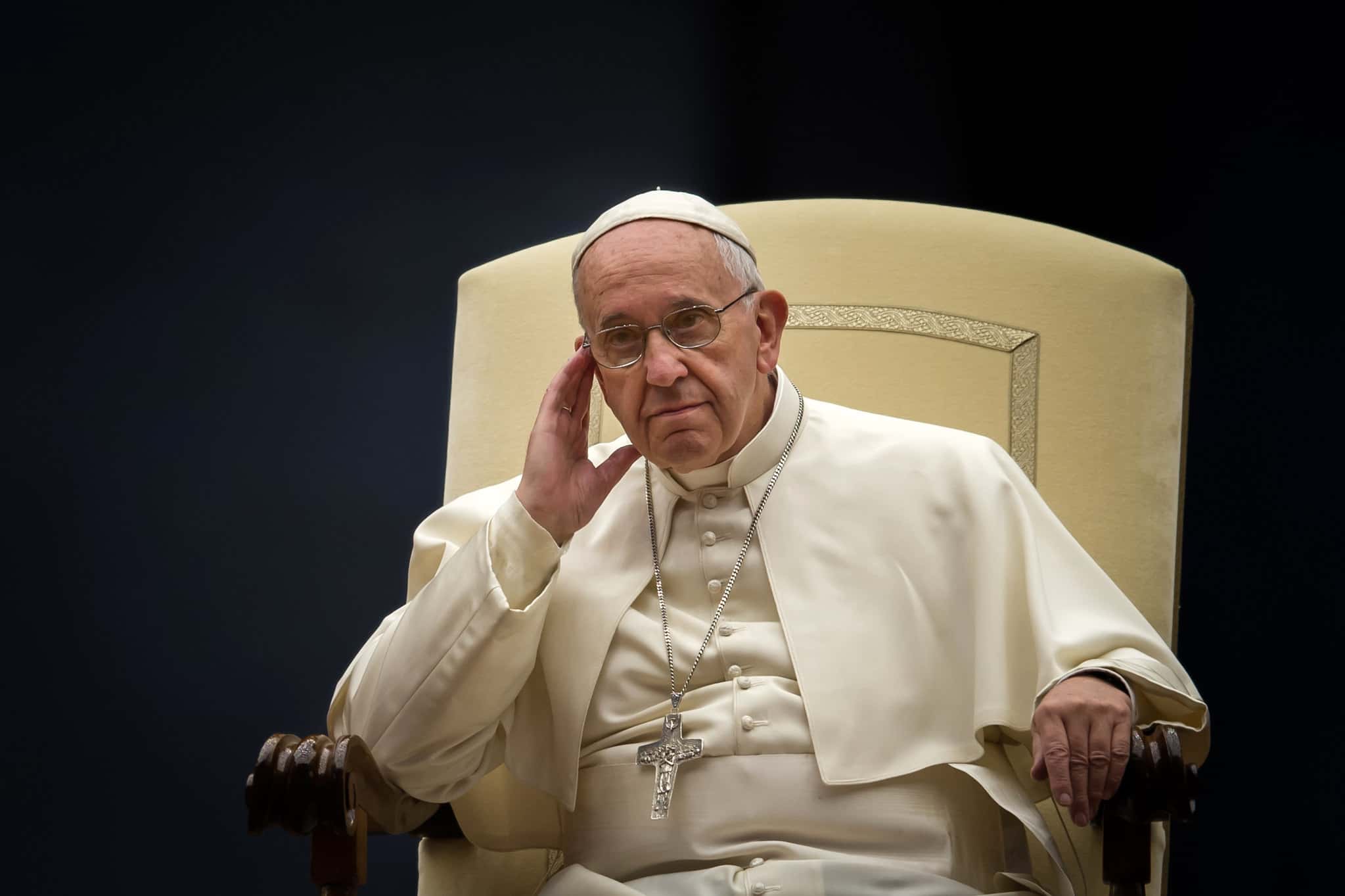 Portrait Photo of Pope Francis in white outfit, seated