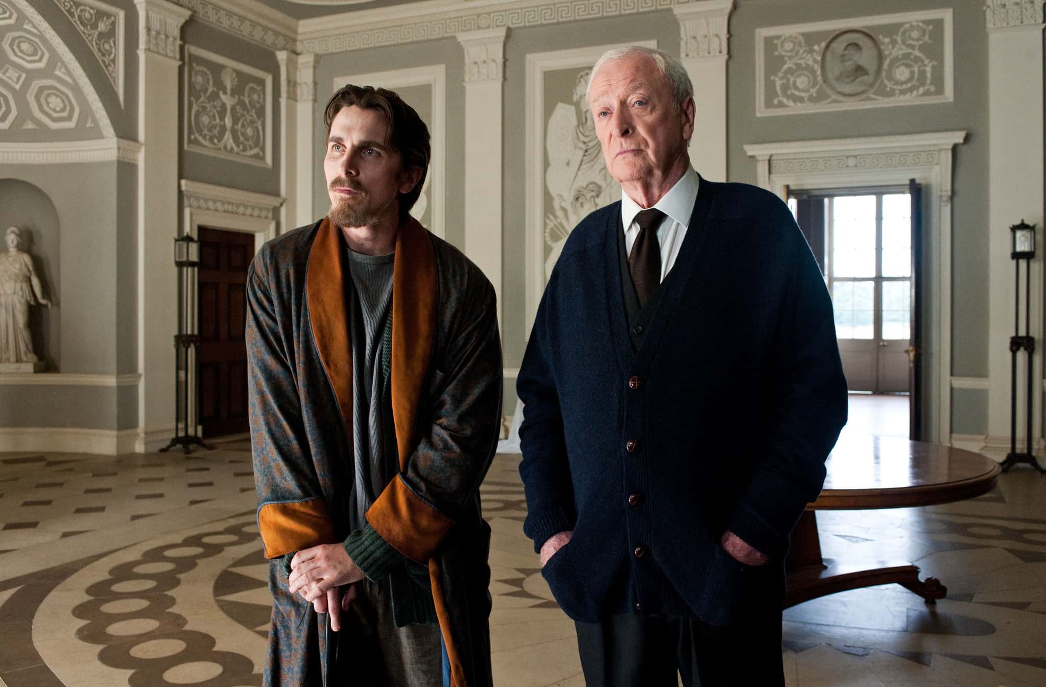 CHRISTIAN BALE as Bruce Wayne and MICHAEL CAINE as Alfred in “THE DARK KNIGHT RISES"