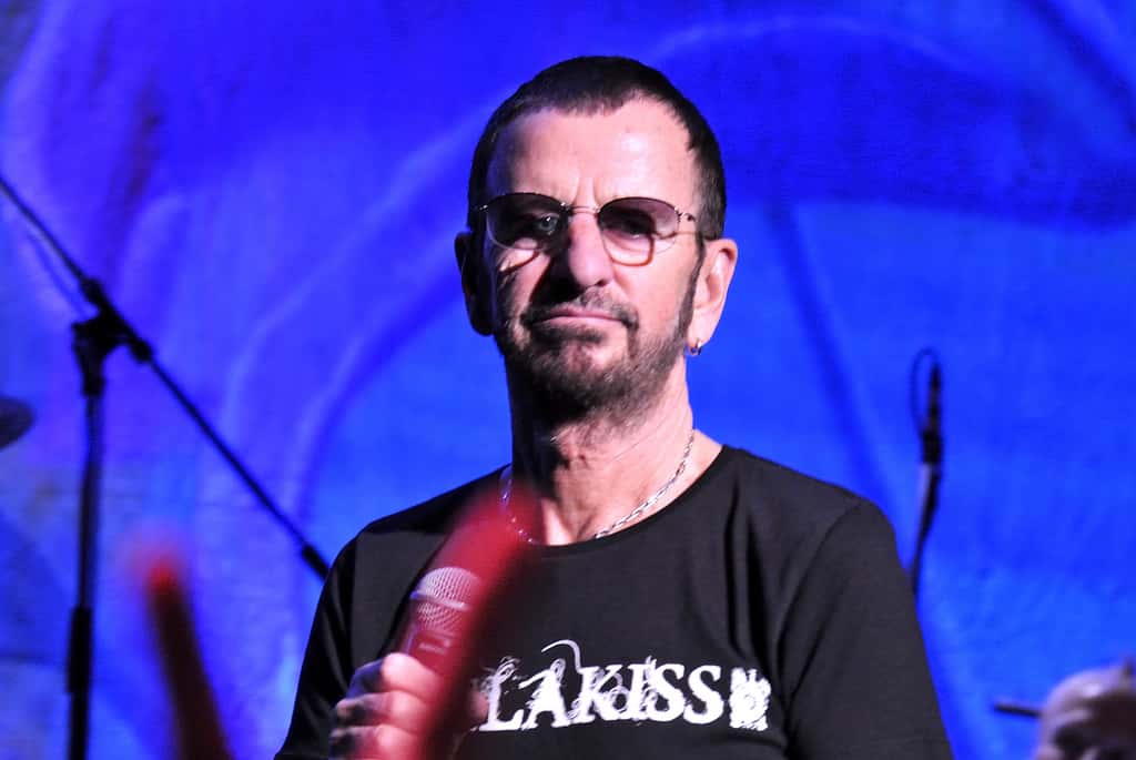 Musician Ringo Star performing on a stage with His All-Starr Band